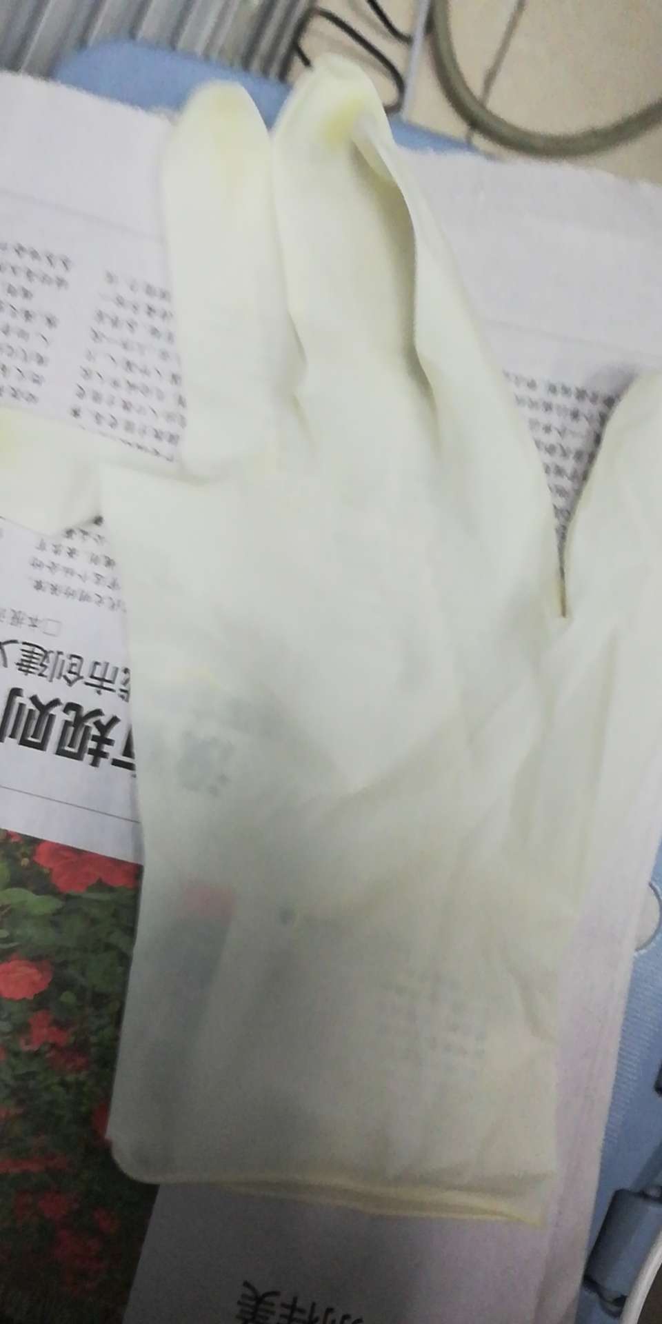 Latex gloves being used in a medical setting during surgery