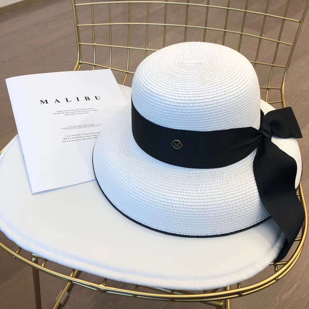 A chanel-style straw hat undefined
