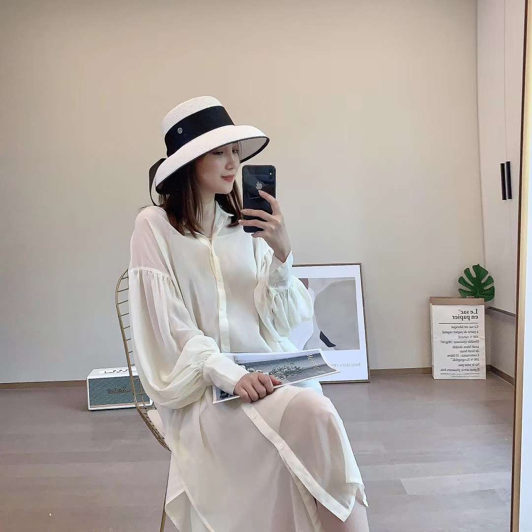 A chanel-style straw hat undefined