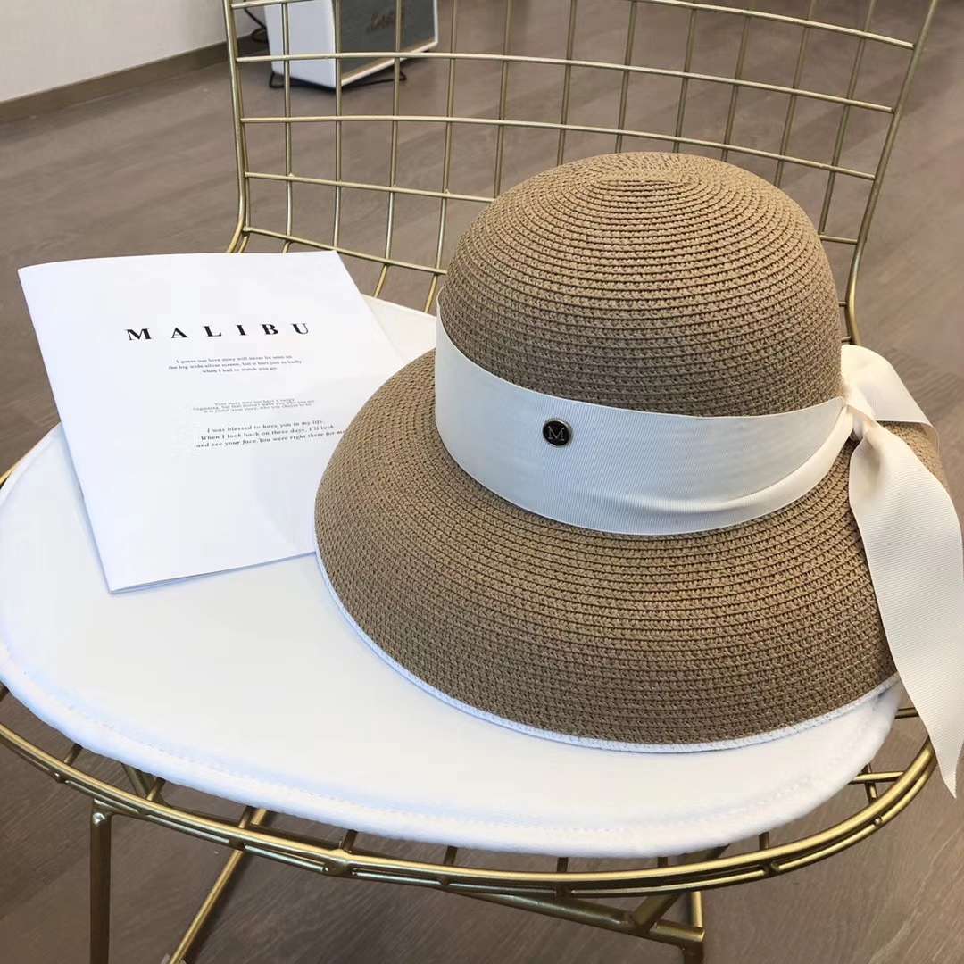 A chanel-style straw hat undefined