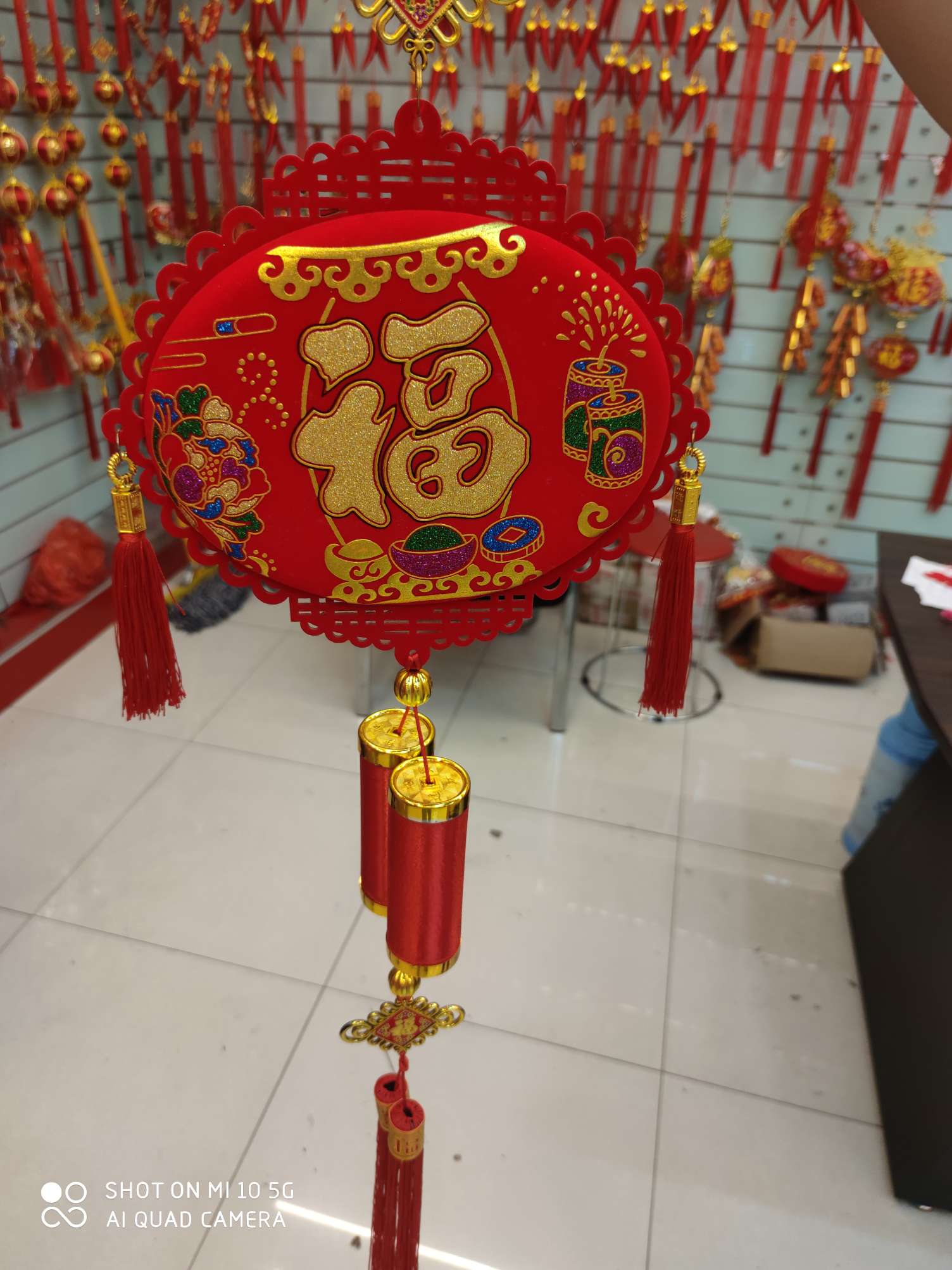 Two firecrackers are hung on the lantern
