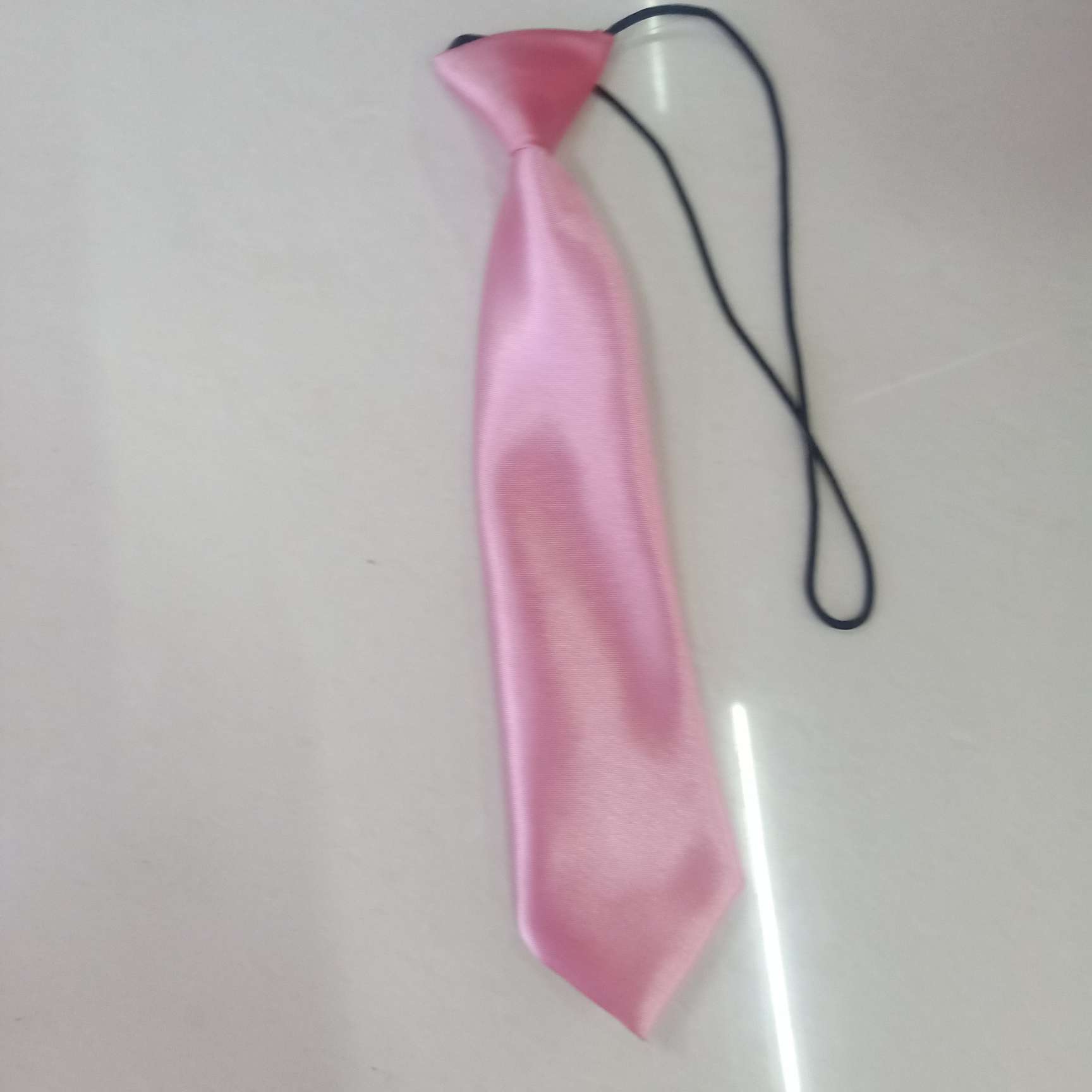 A pink round elastic tie details Picture