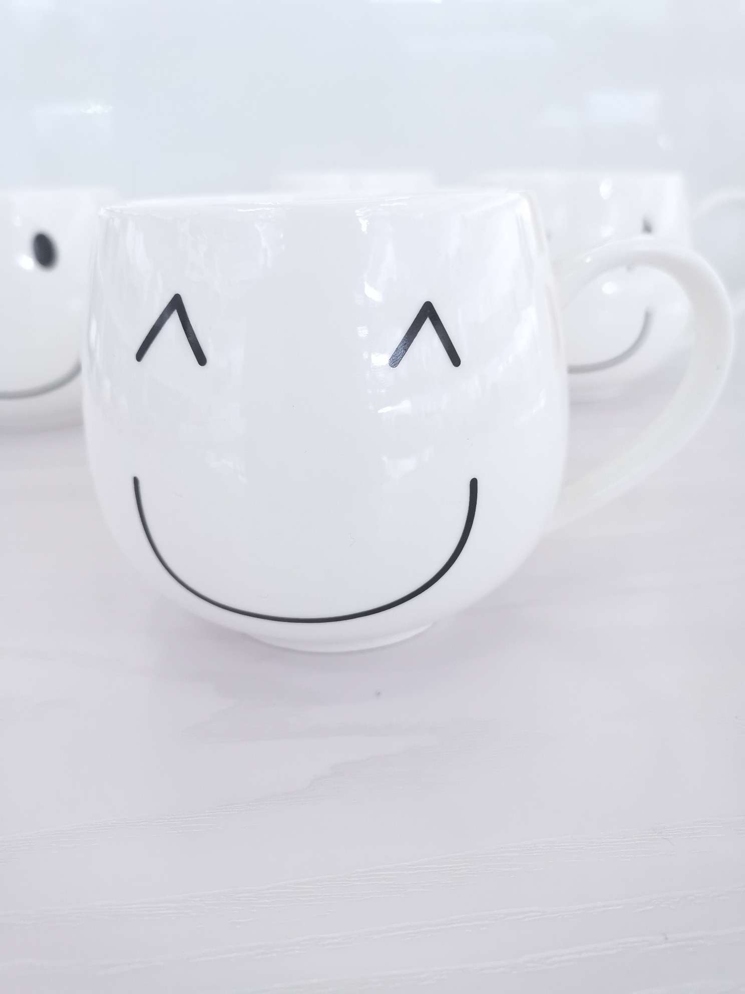 Simple and cute smiling ceramic cups, coffee cups, water cups undefined