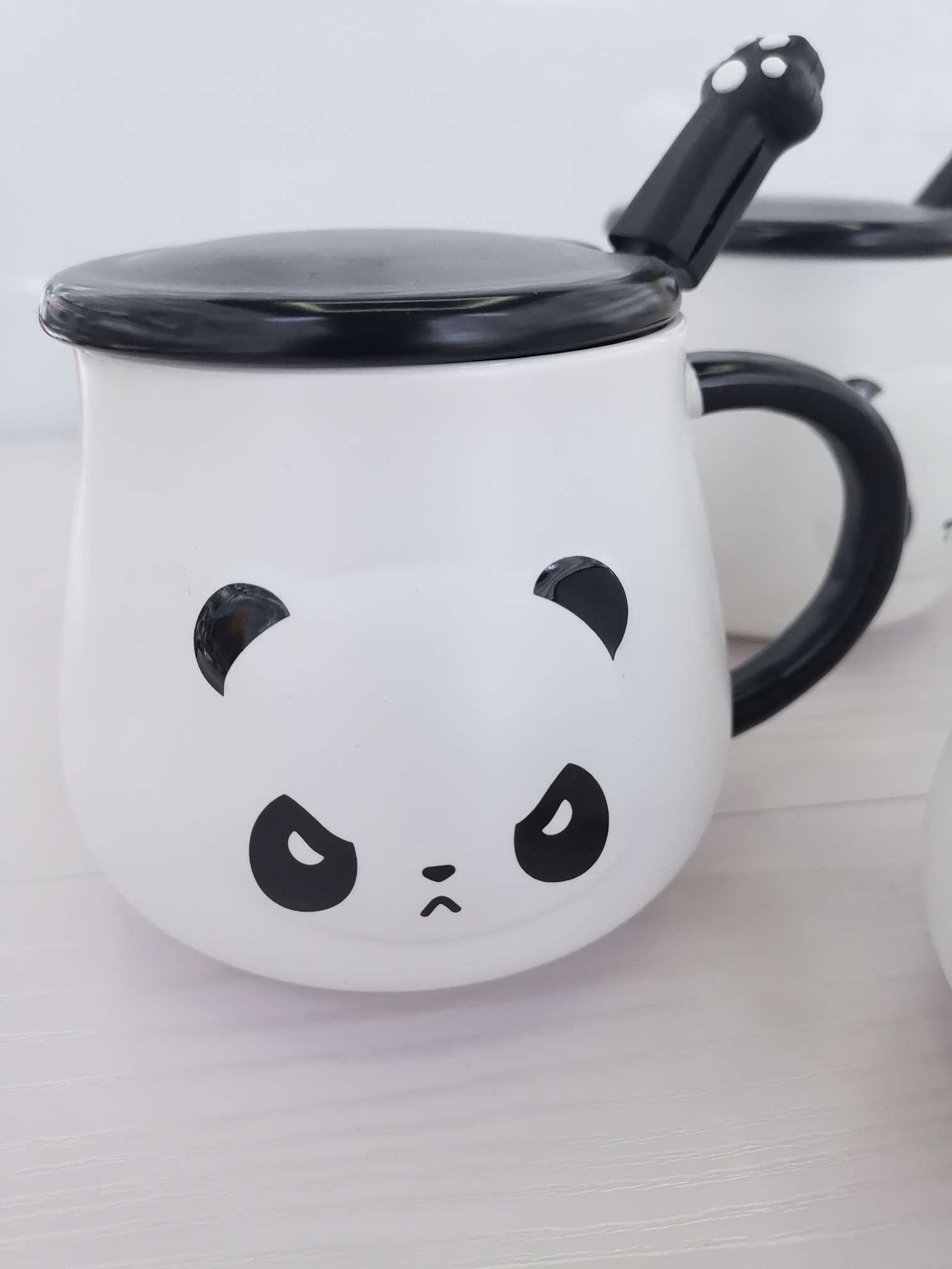 Three-dimensional panda-shaped ceramic cups, coffee cups and water cups undefined