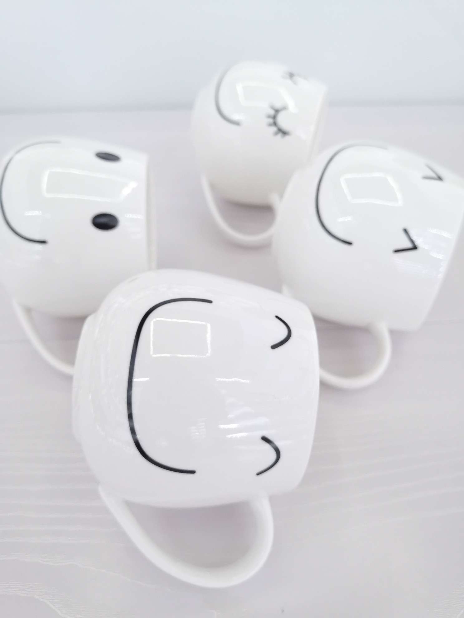 Simple and cute smiling ceramic cups, coffee cups, water cups undefined