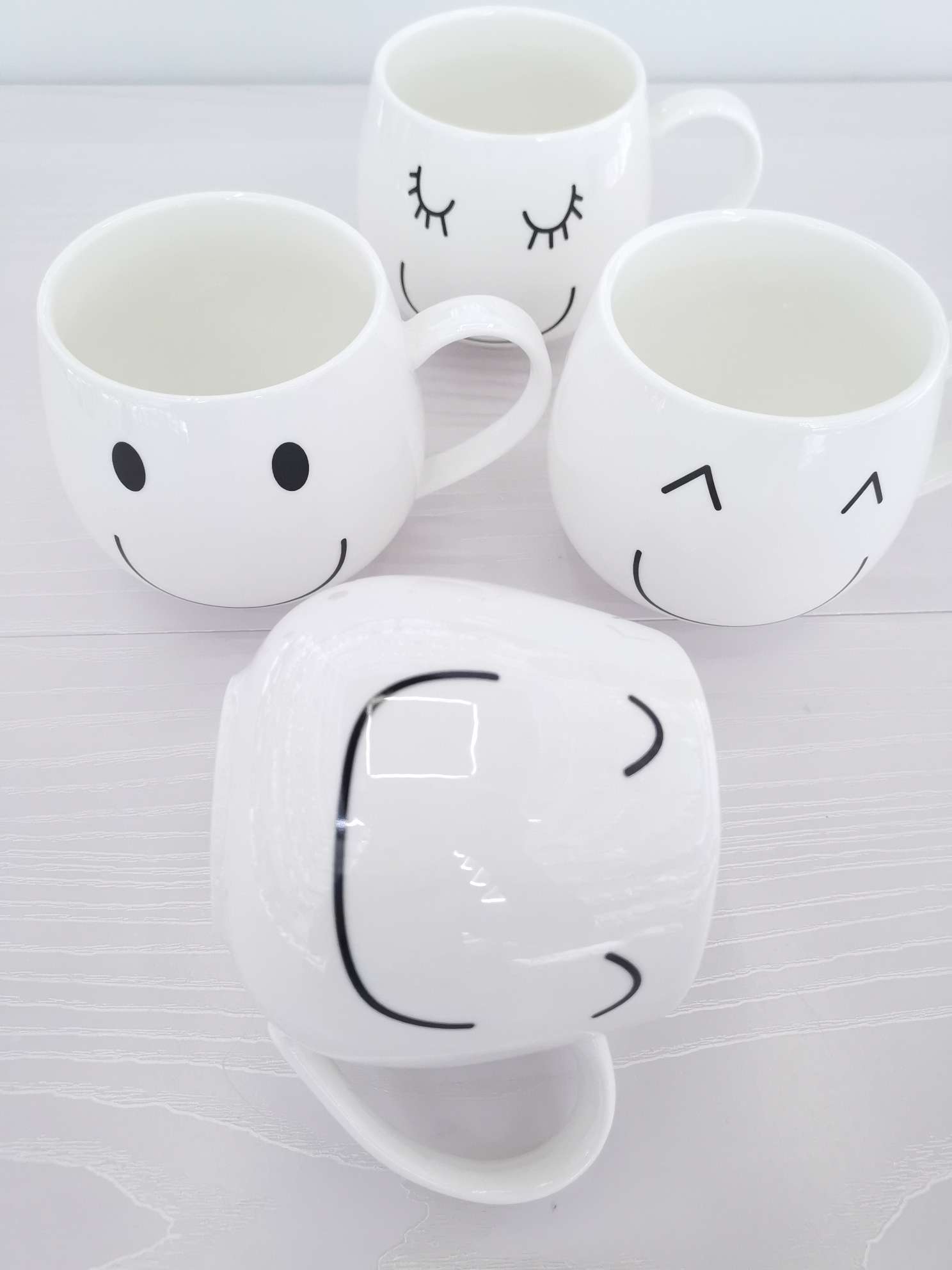 Simple and cute smiling ceramic cups, coffee cups, water cups undefined