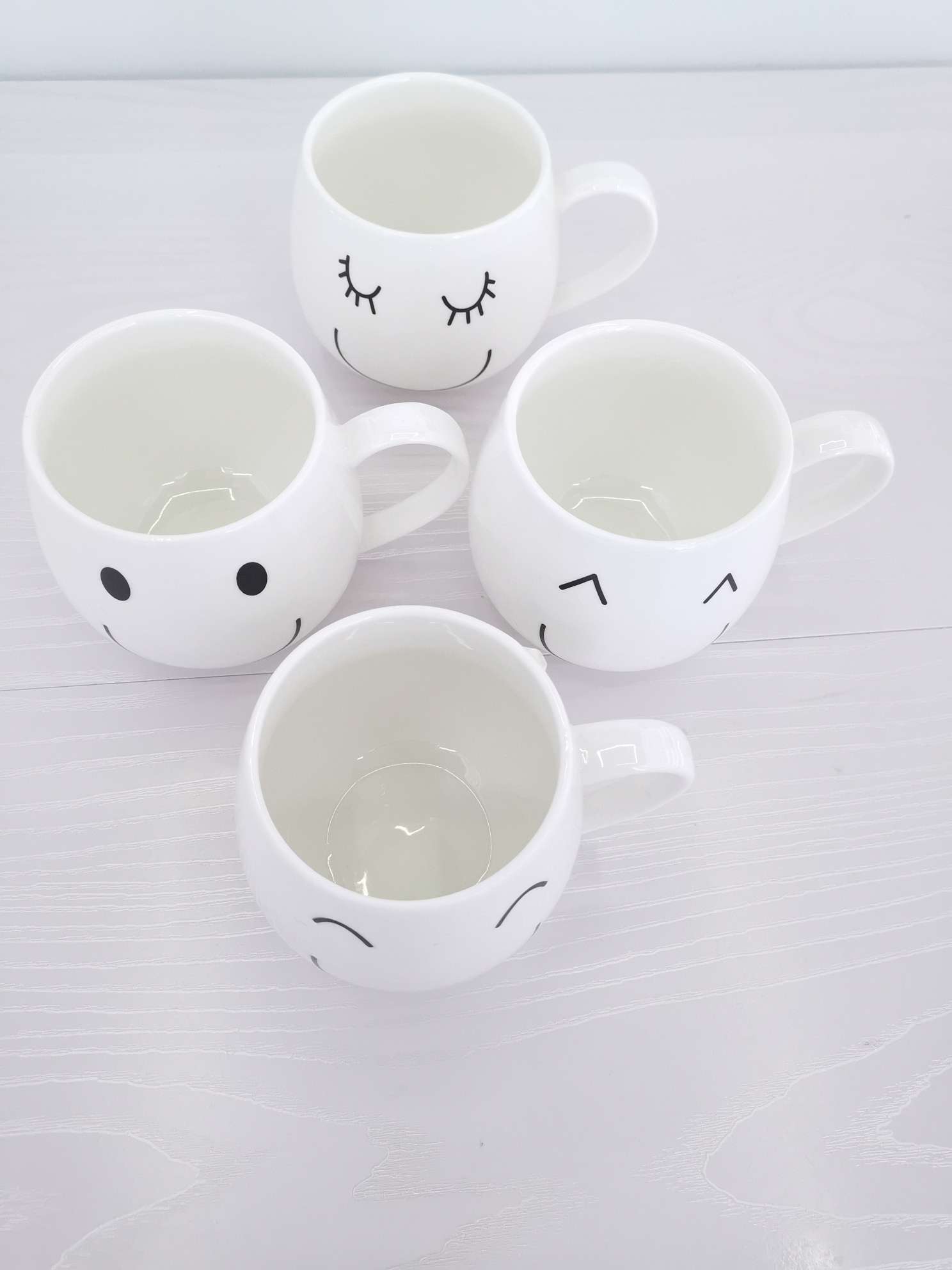 Simple and cute smiling ceramic cups, coffee cups, water cups undefined