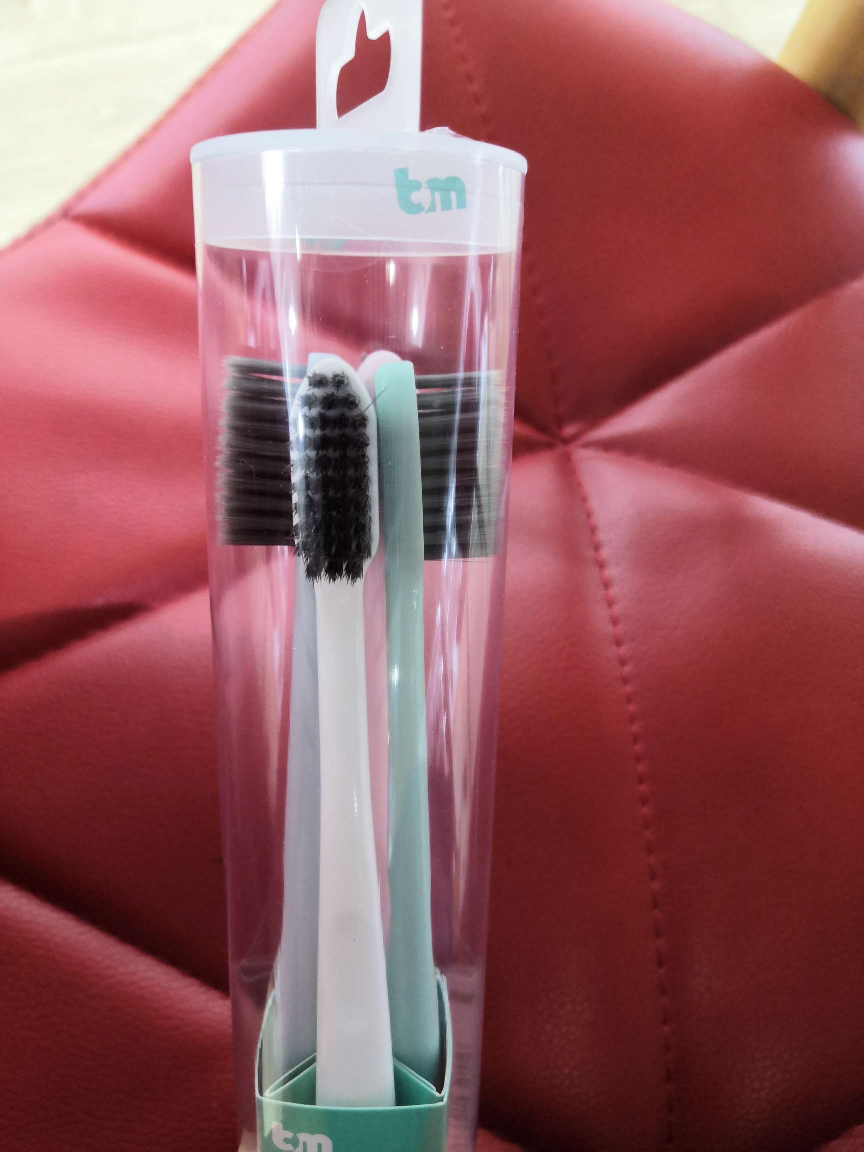 Four adult toothbrushes for family storage