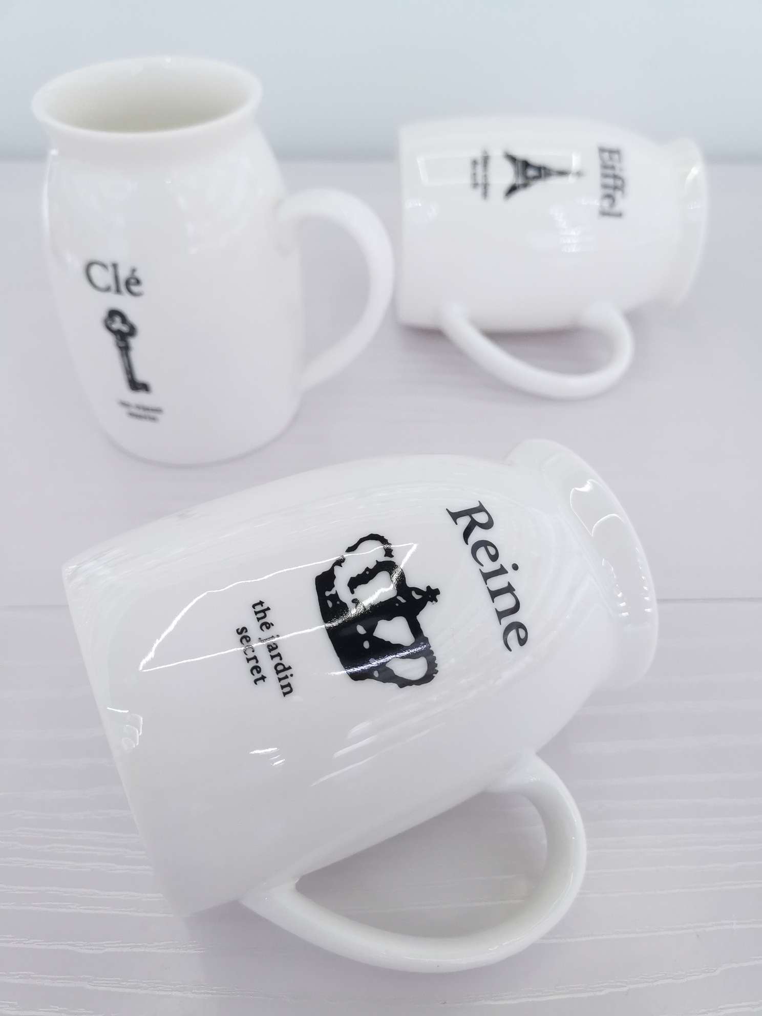 Simple white glossy ceramic milk cups and water cups undefined