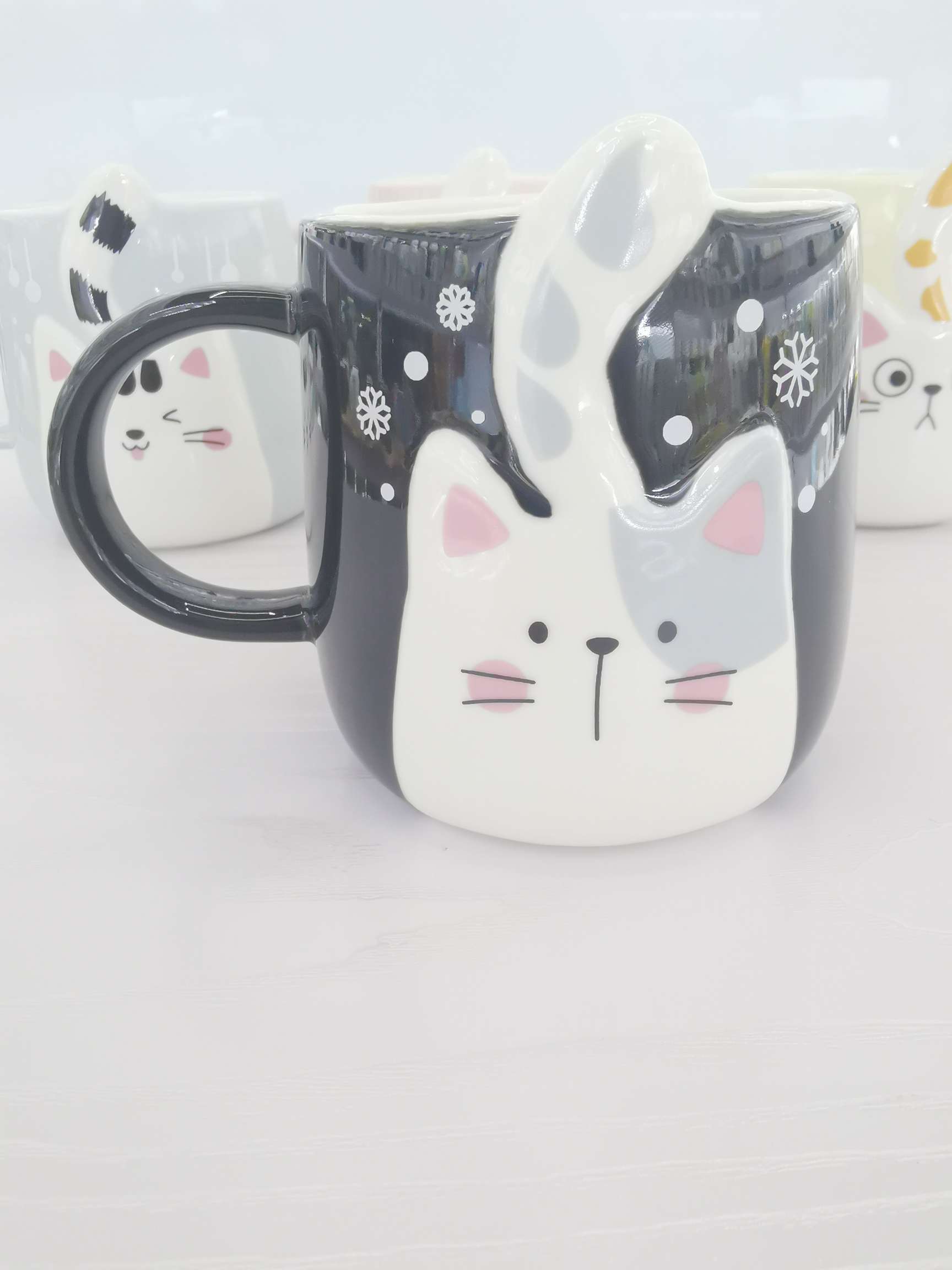 Cute cat-shaped colored glazed ceramic cups, coffee cups and water cups undefined