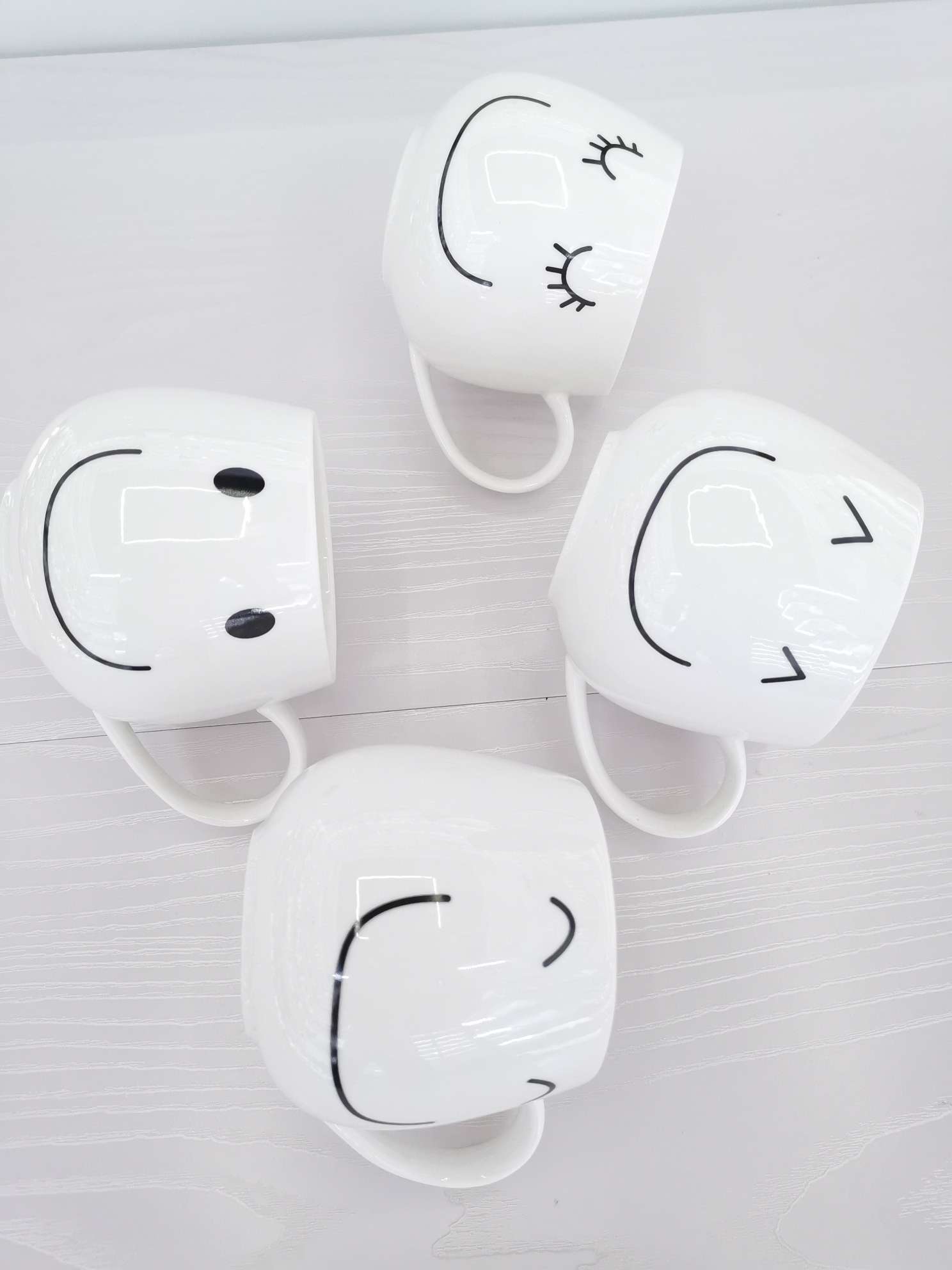 Simple and cute smiling ceramic cups, coffee cups, water cups