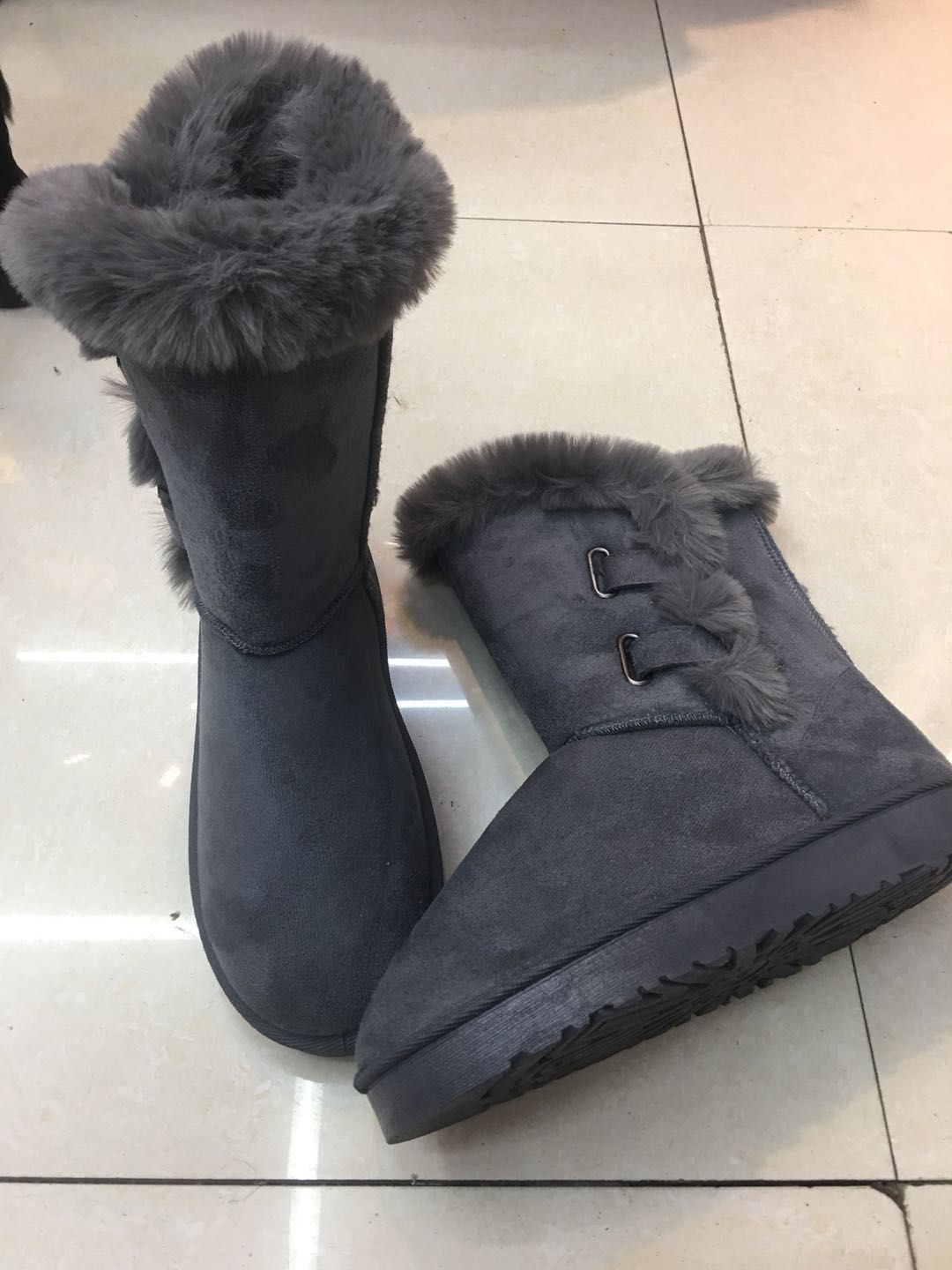 A woman in double-buttoned rabbit fur boots