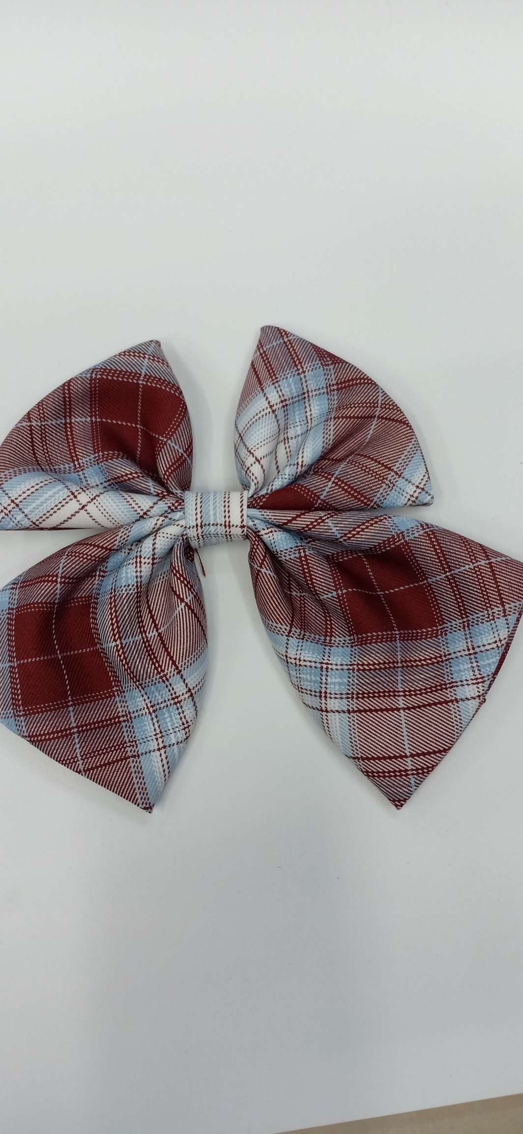 The checkered headdress is in coffee color
