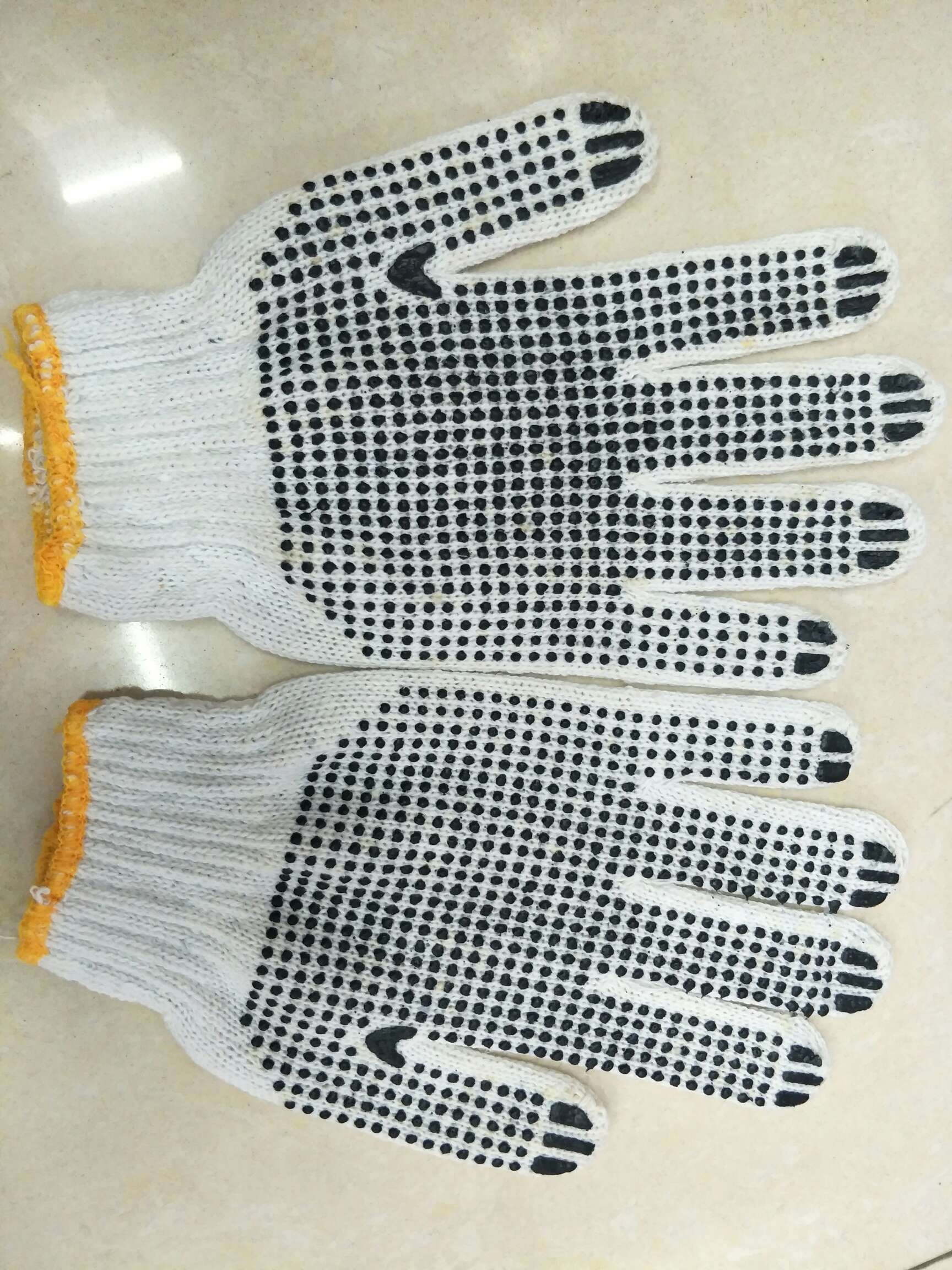 700 grams of black dot gloves thumbnail