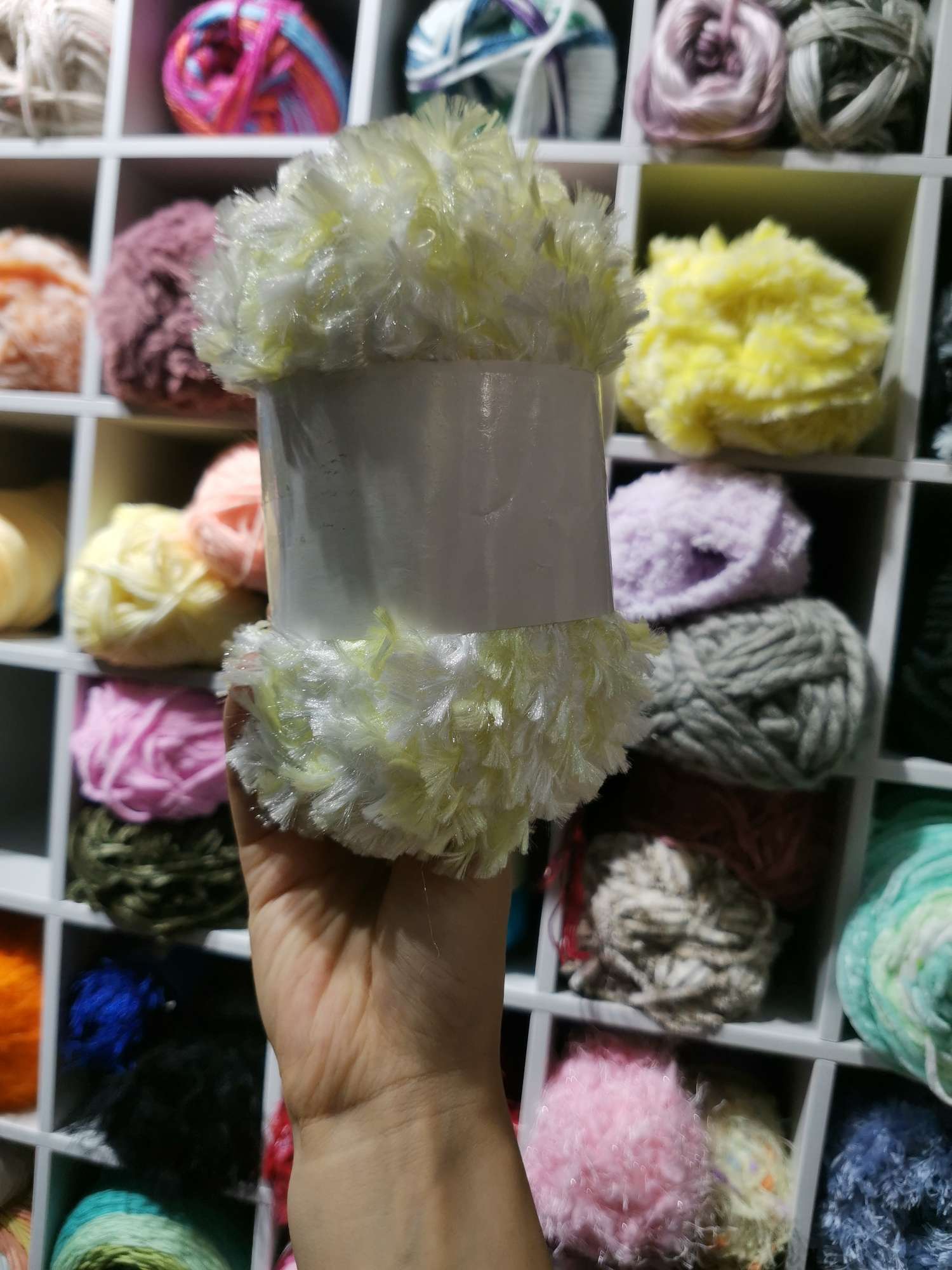 In stock of knitted yarn segments dyed with colored dog hair yarn