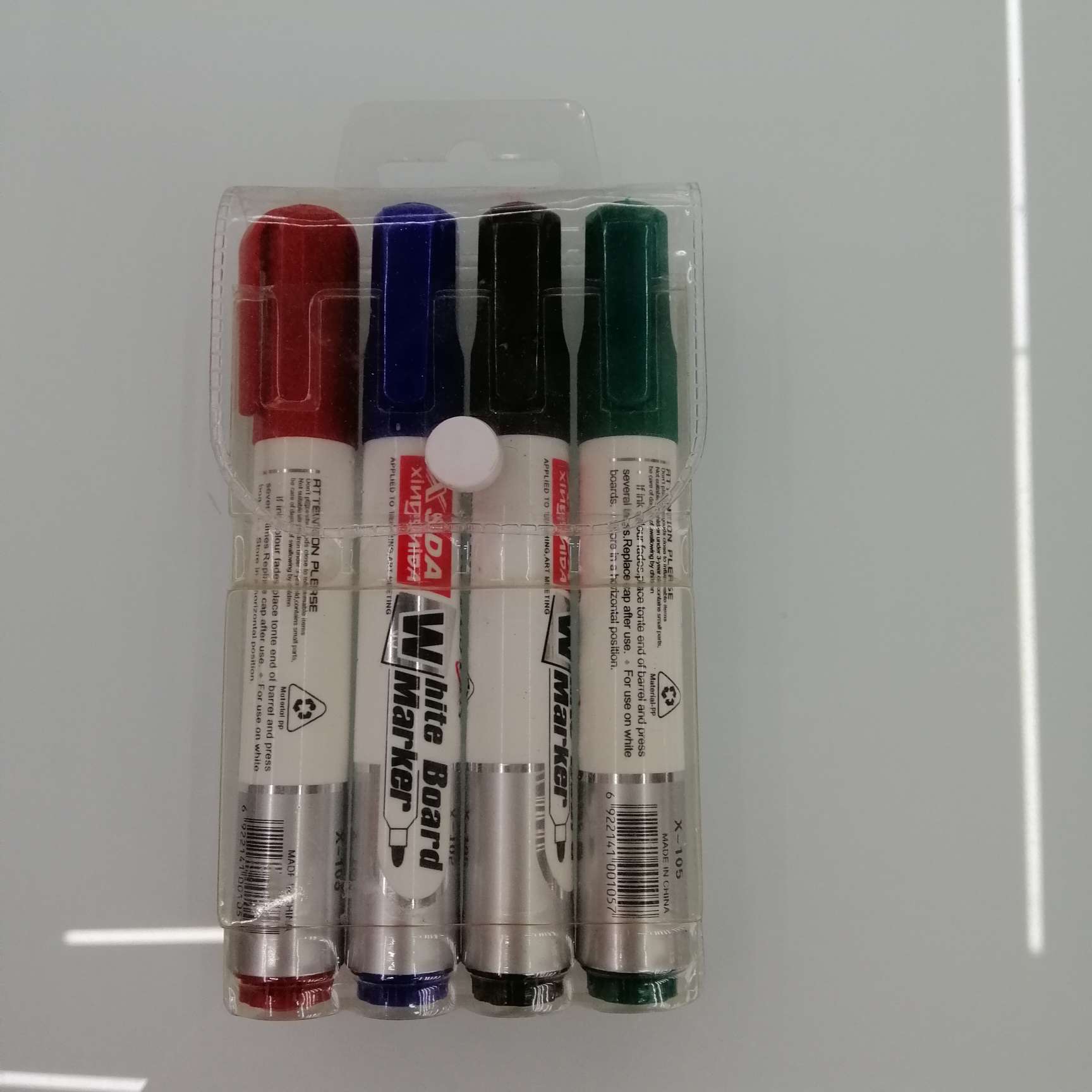 Four 105 whiteboard pens in a P V bag full figure
