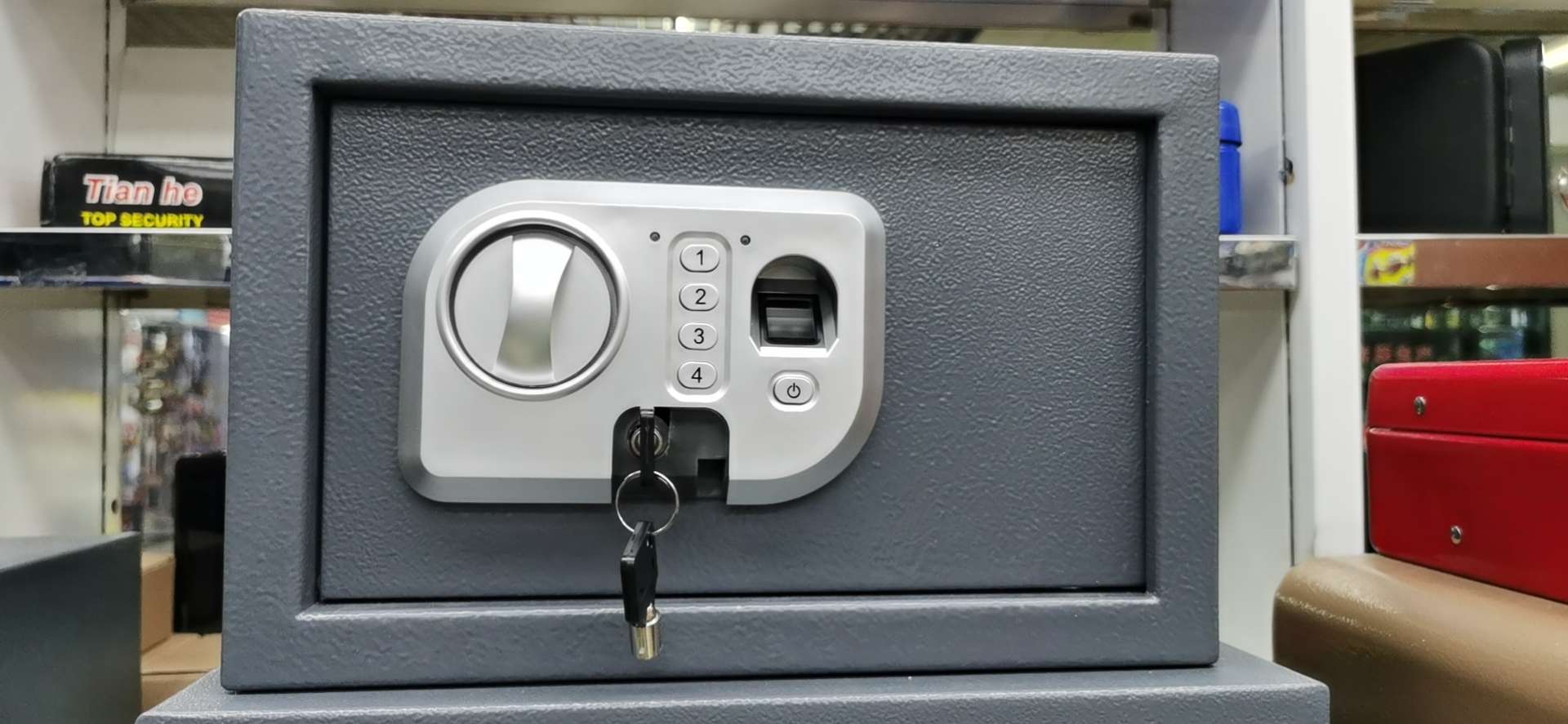 13407 Xinsheng Lock Industry Household Small Fingerprint Savings and Storage Iron Box Desktop Office Safe T20ZW Application Scenario