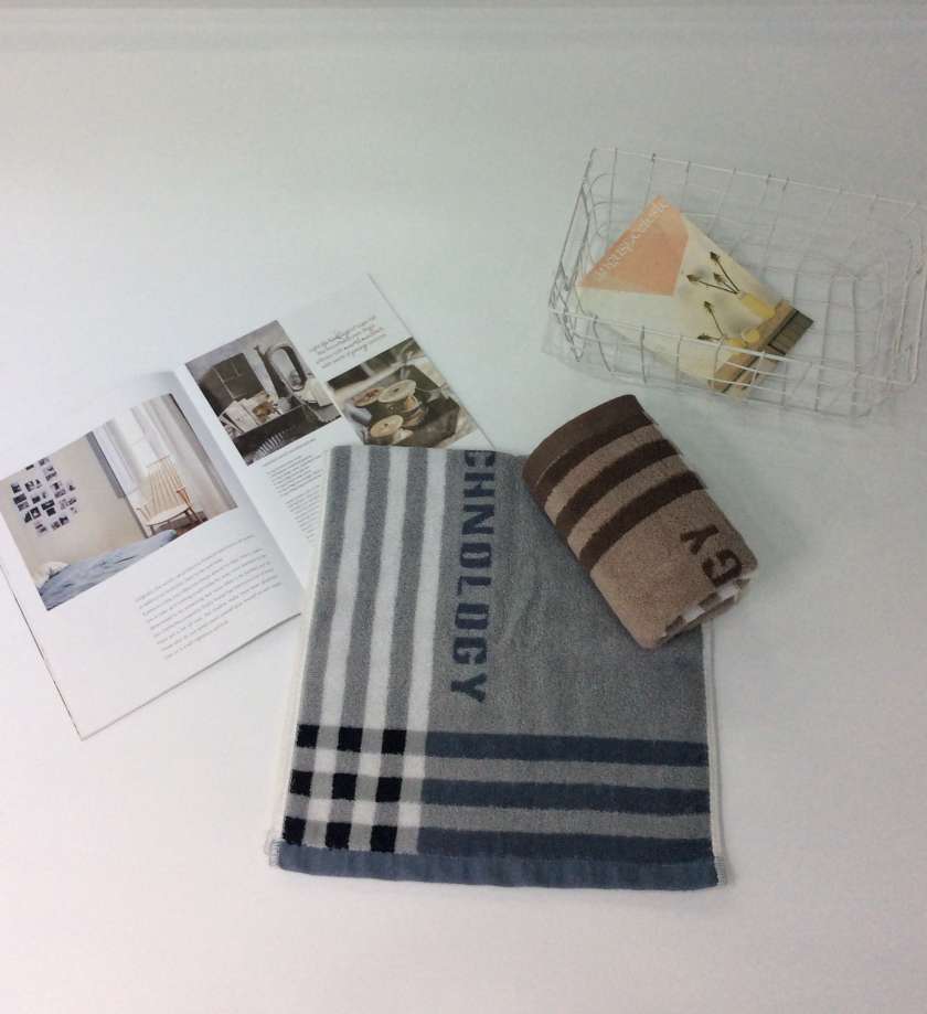 Interwoven striped face towel