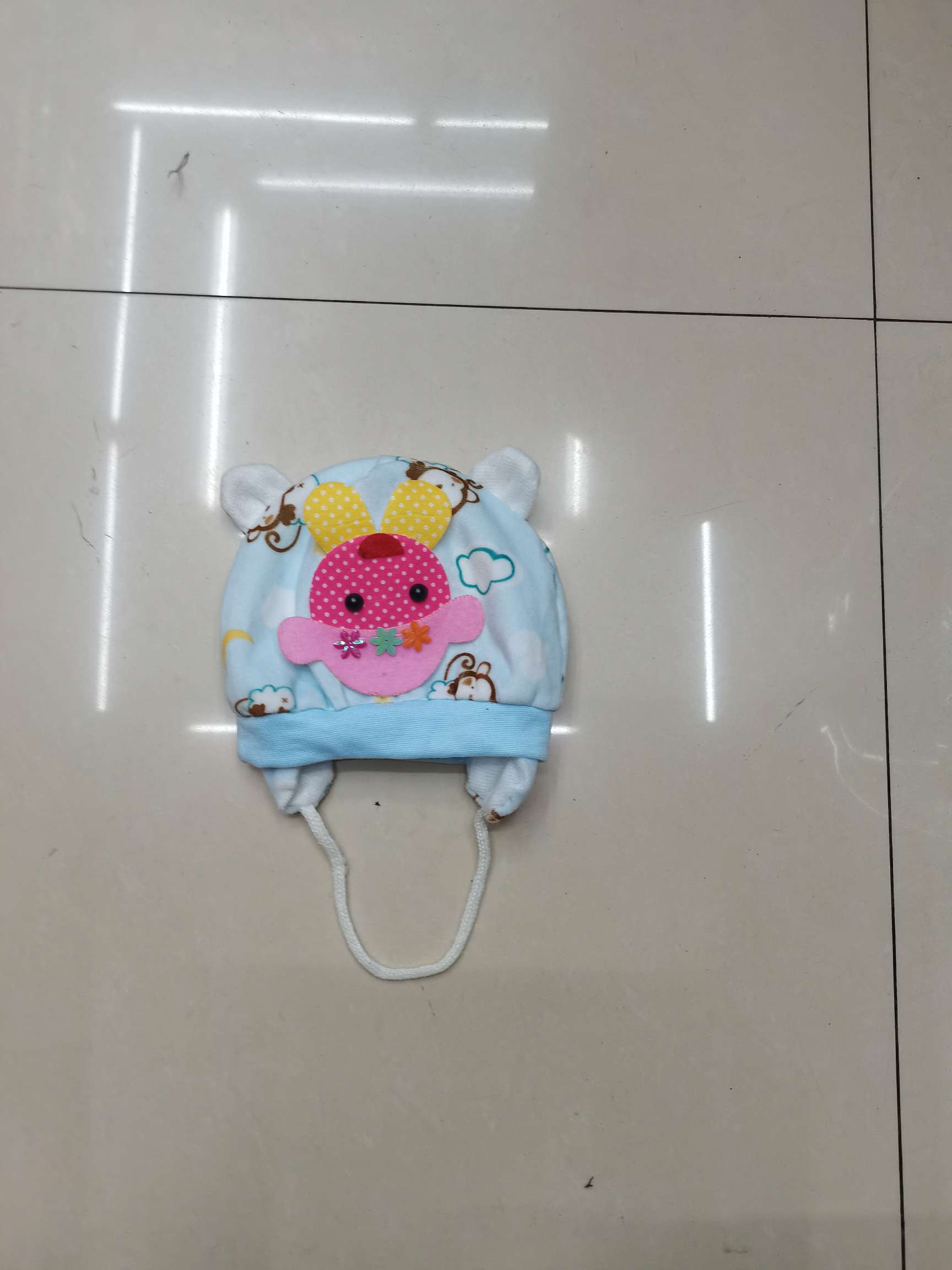 Baby cap with doll head