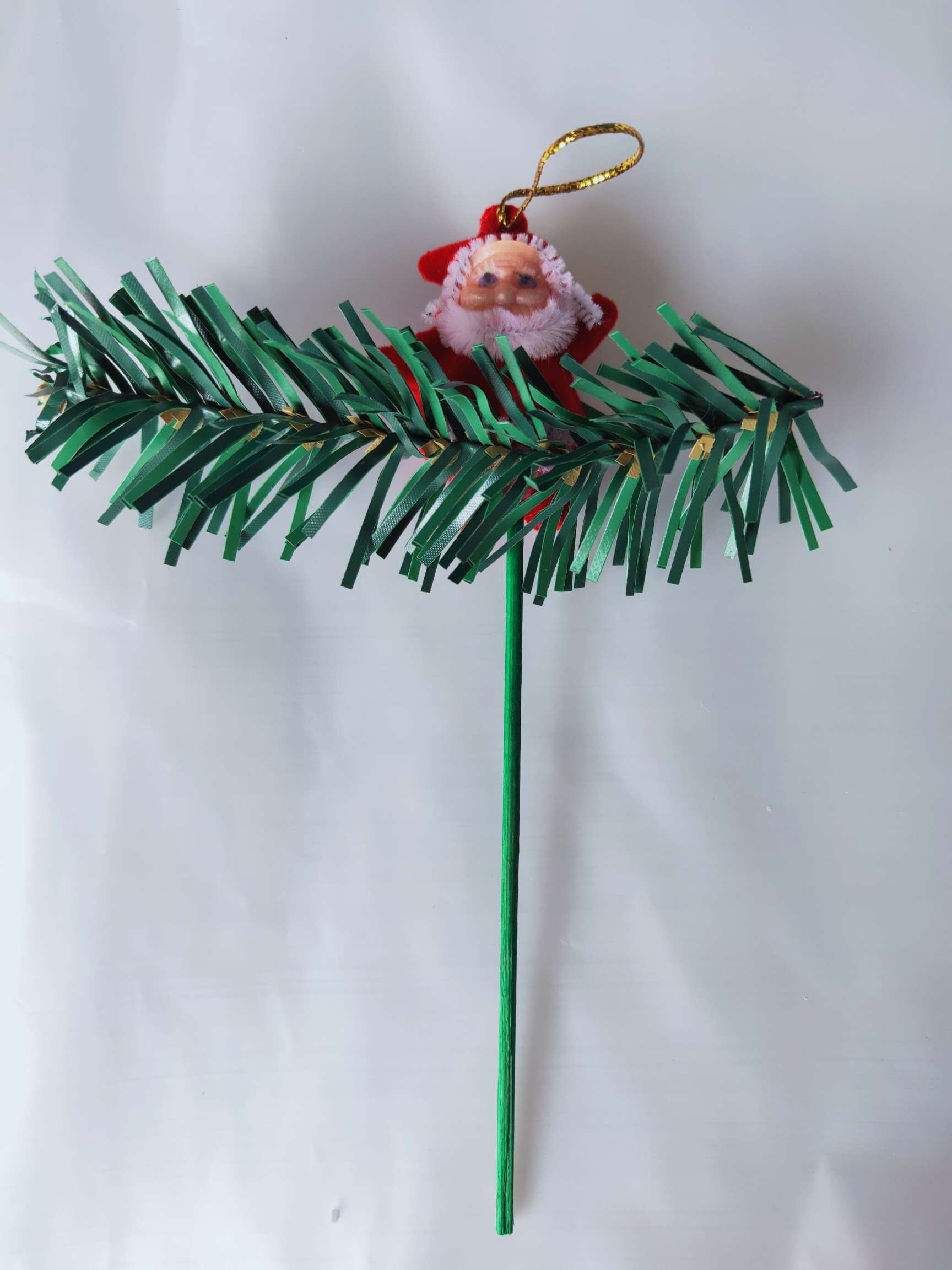 Santa Claus adorns Christmas toys, gifts and Christmas tree decorations full figure