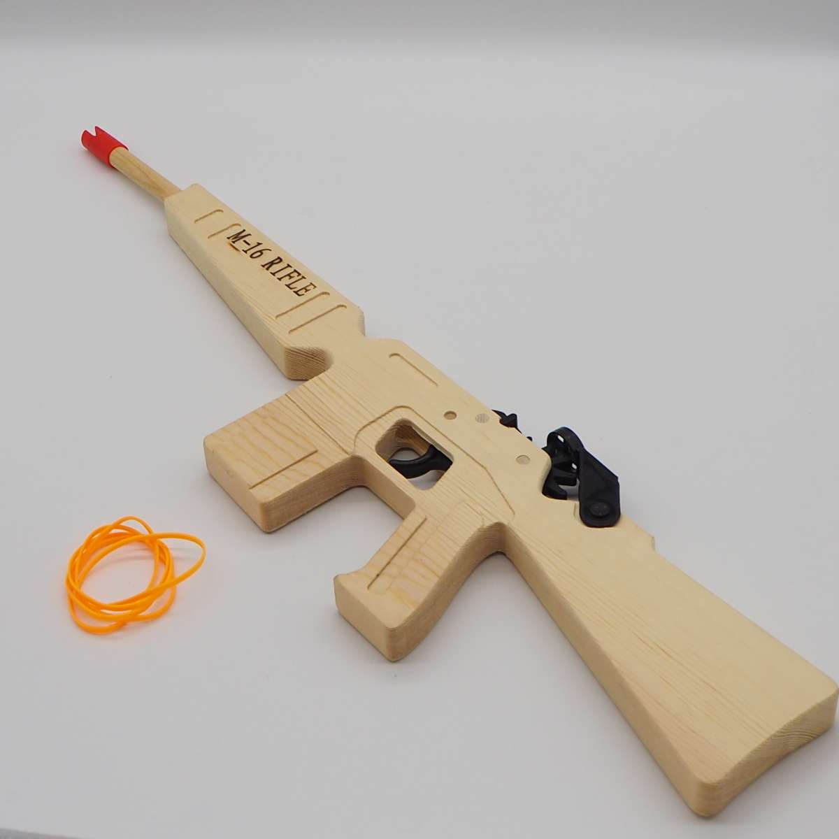 Factory direct sales of rubber band long charge white wood gun, continuous shooting ring gun, pine wood toy gun, M-16 children's toy ring continuous shooting gun Specification image