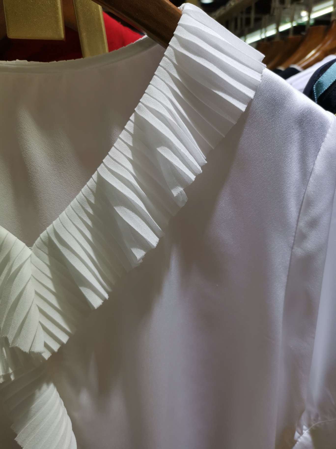 A fashionable women's top with a large lace V-neck details Picture