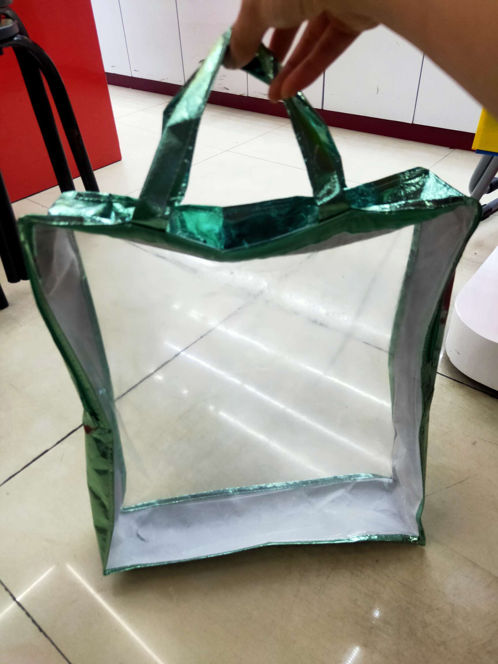 Hand-held packaging bag