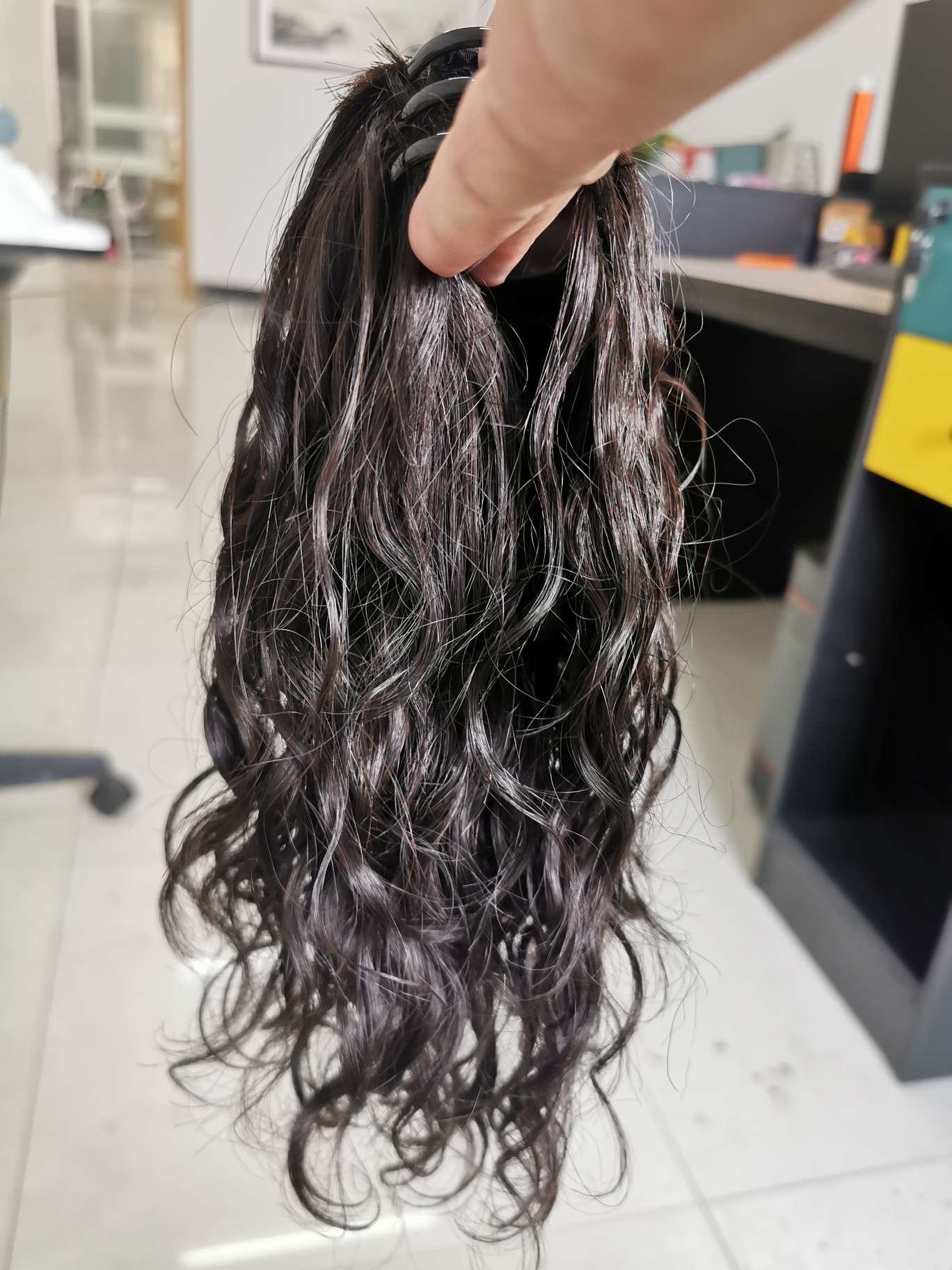 100% real hair, human hair clipped in a ponytail, curly style undefined