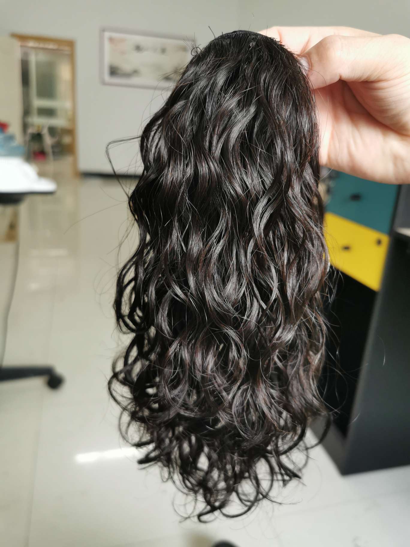 100% real hair, human hair clipped in a ponytail, curly style undefined