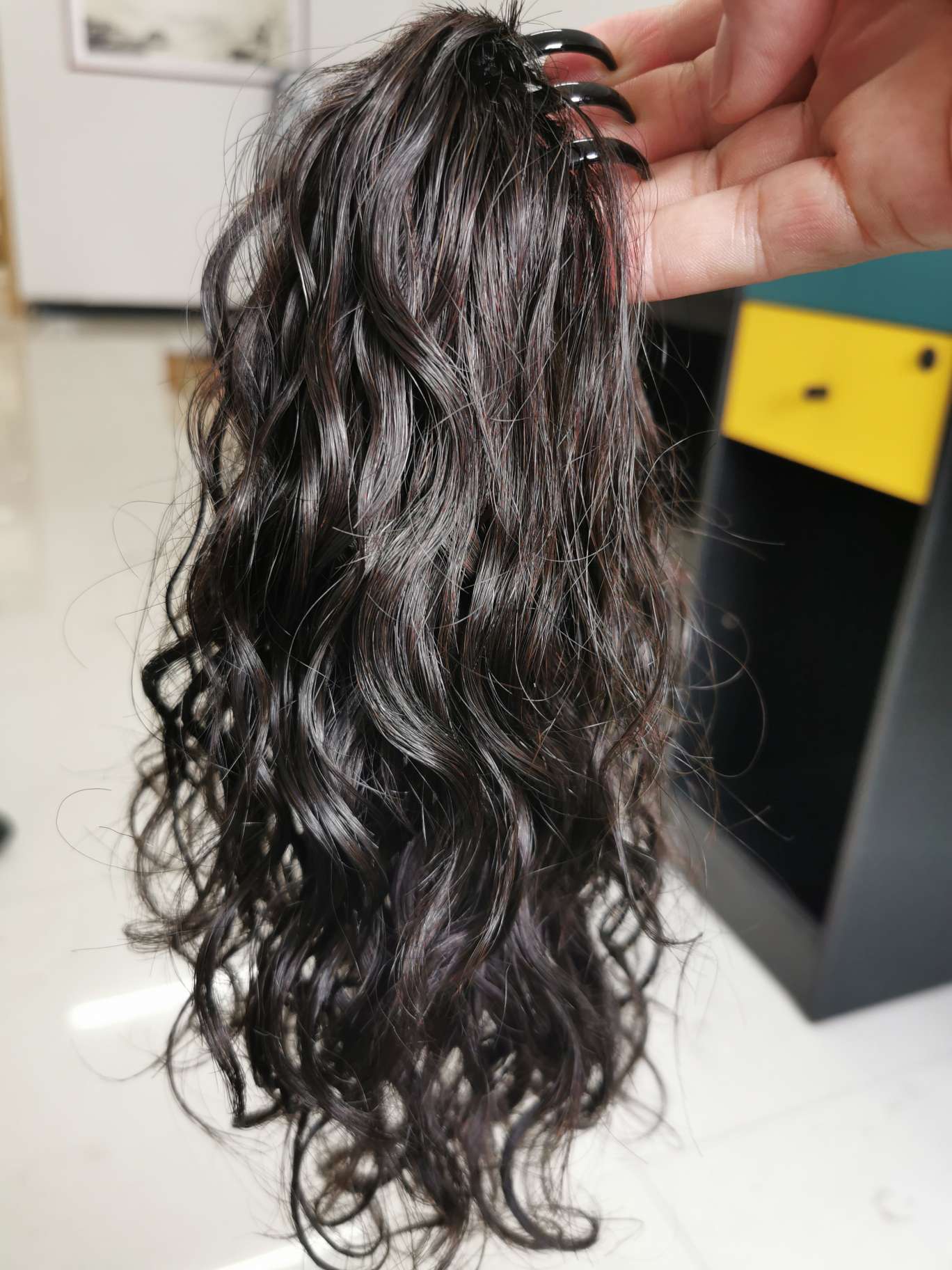 100% real hair, human hair clipped in a ponytail, curly style undefined