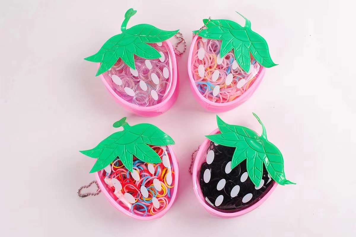 The strawberry bag pulls the rubber band