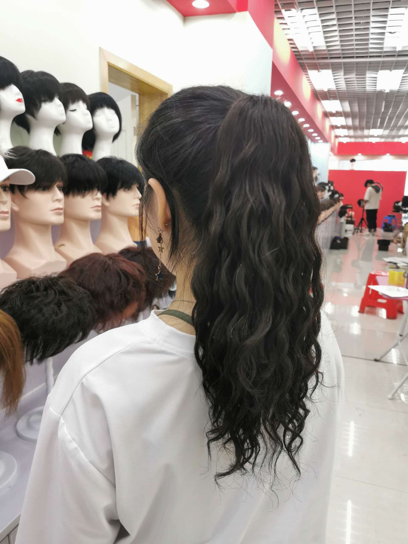 100% real hair, human hair clipped in a ponytail, curly style undefined