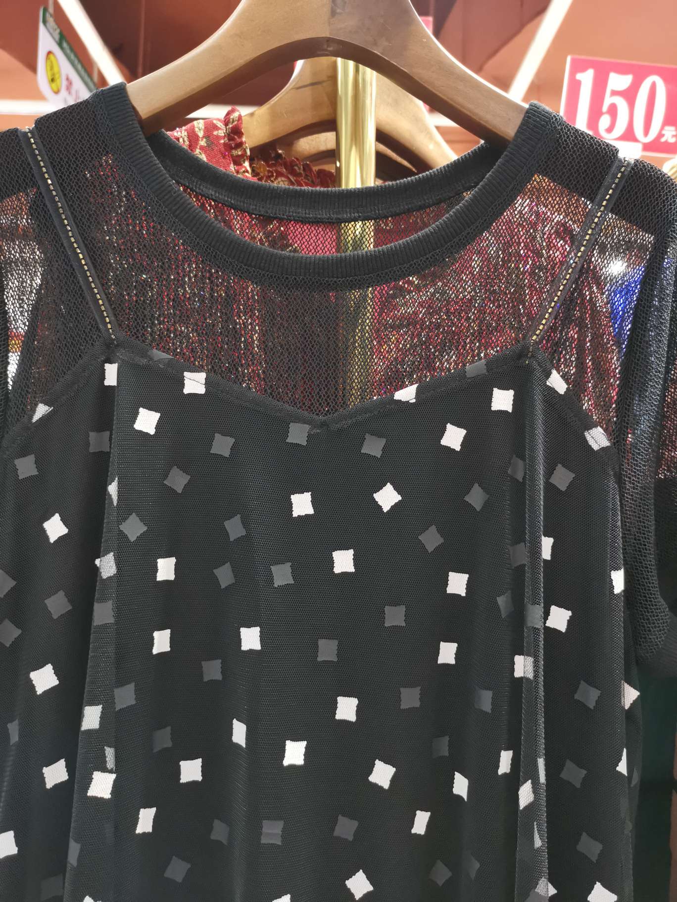 A fashionable halter top reveals a double-layered dress details Picture