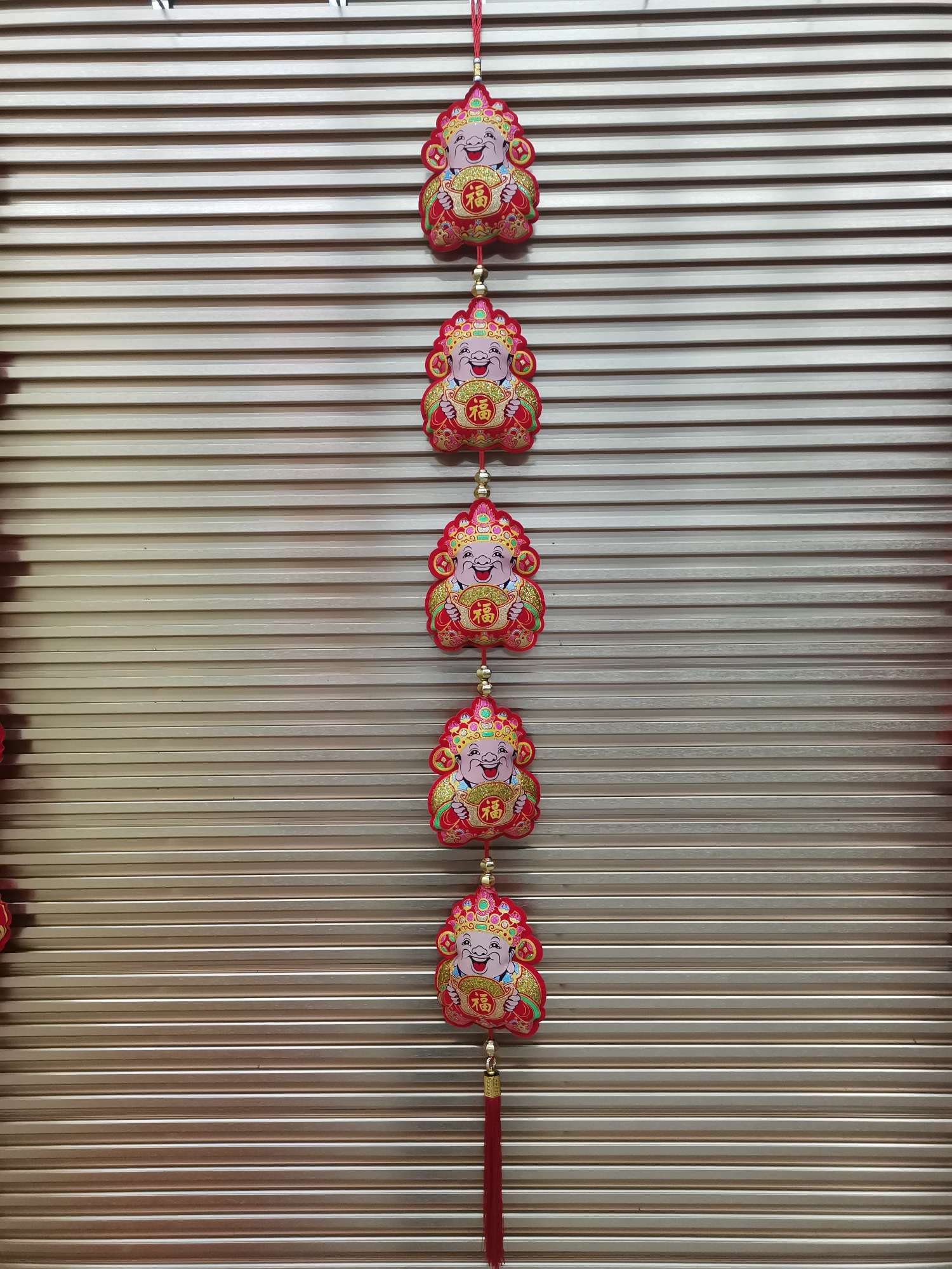 A large wealth god string printed with velvet gold powder and colored paste