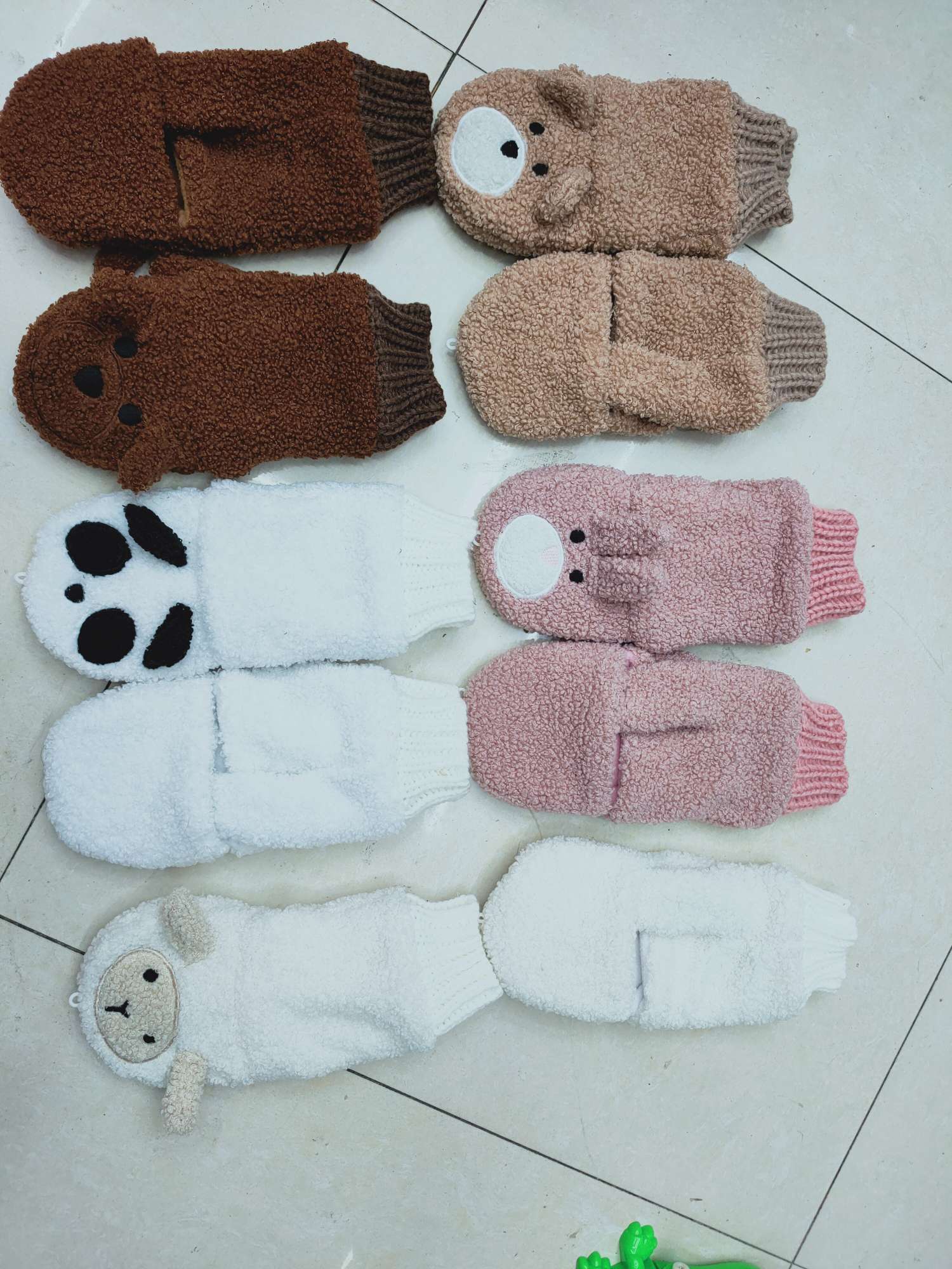 A woman with plush gloves in winter details Picture