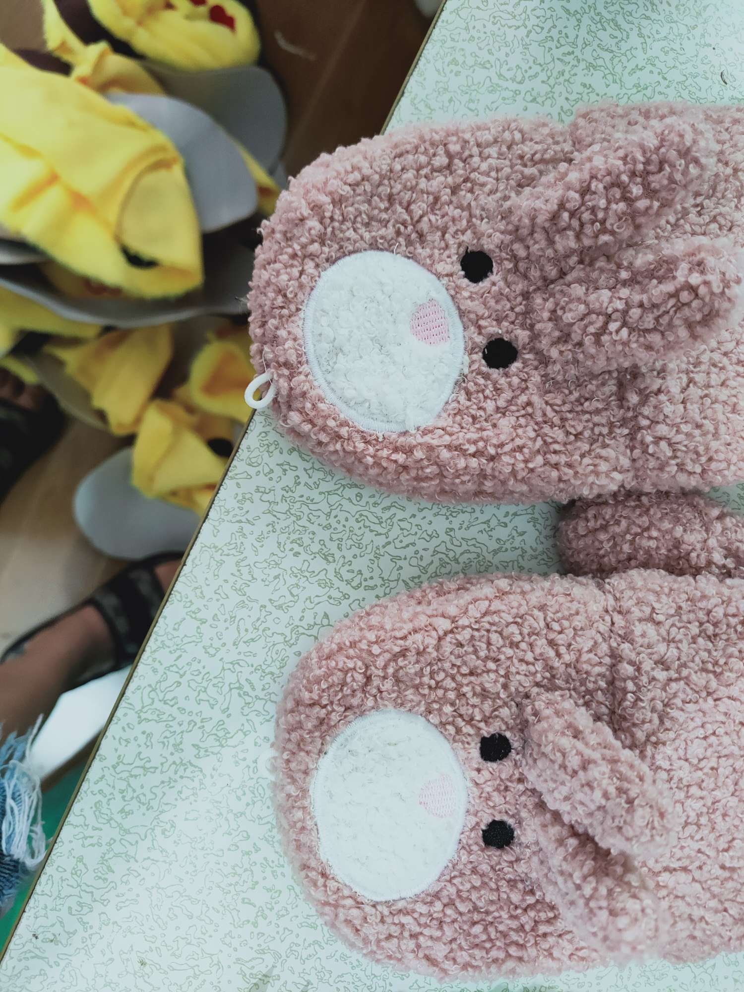 A woman with plush gloves in winter Specification image