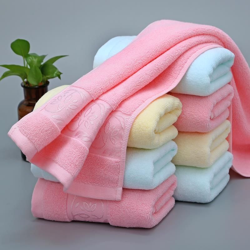 A plain, gold-threaded, all-cotton, non-shedding bath towel for both men and women