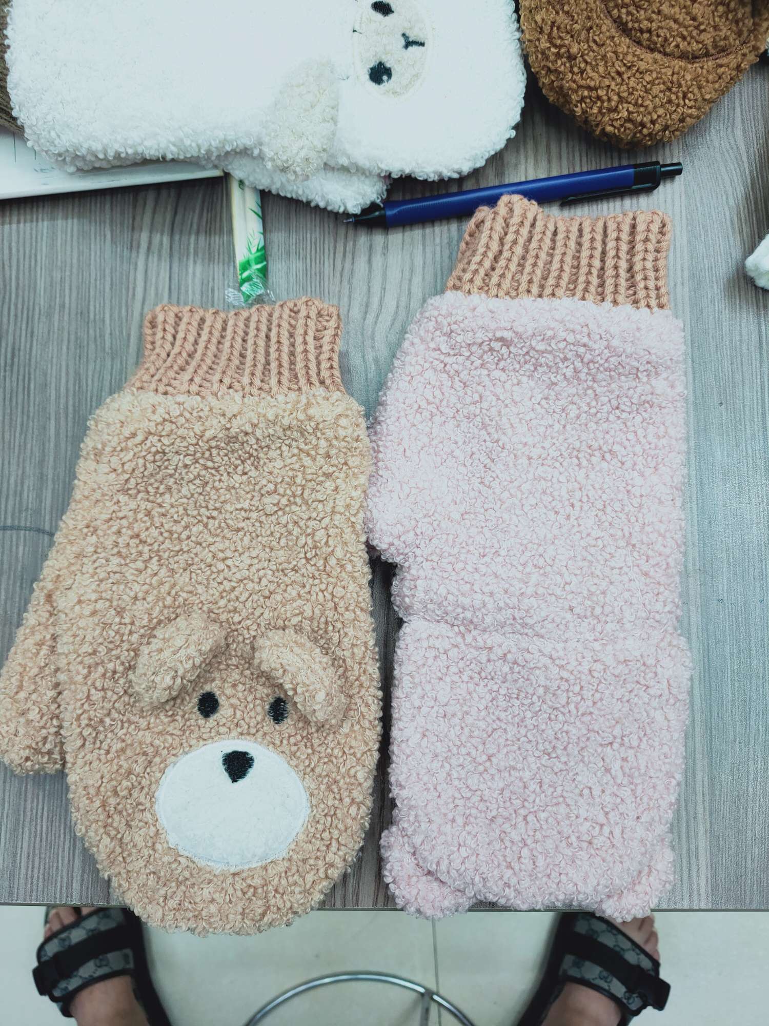 A woman with plush gloves in winter