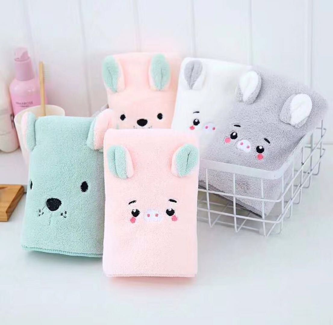 The coral fleece single-color cartoon embroidered thread pattern absorbent towel is soft, comfortable and dries quickly