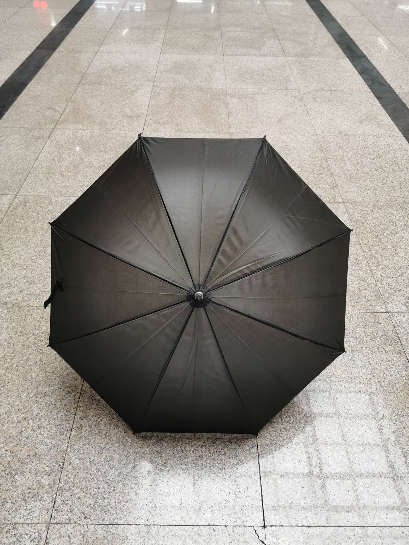 The "Little Black Umbrella" funeral product features a straight, all-black umbrella details Picture