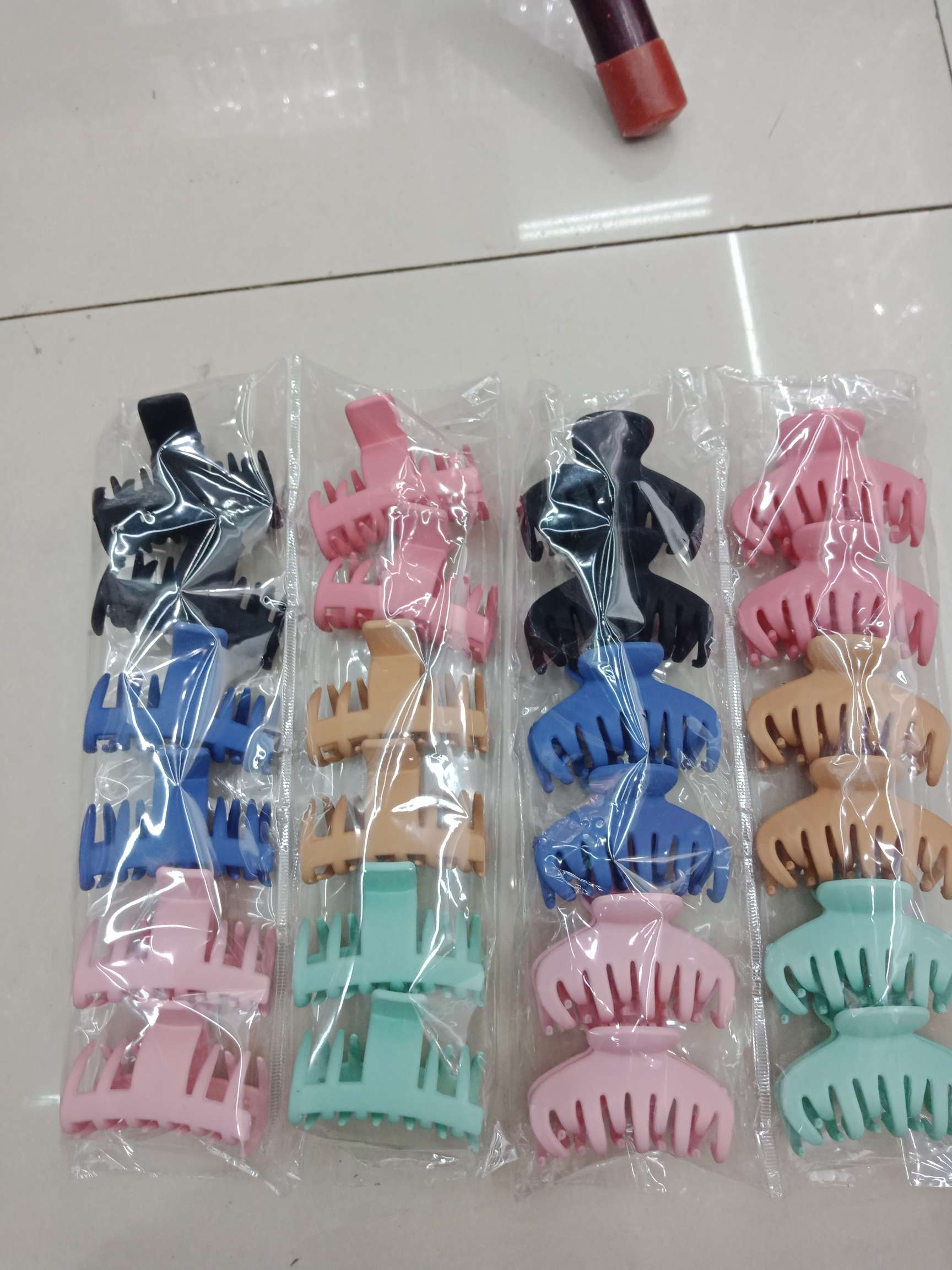 The back of the head with a hair clip and the top with a shark clip. thumbnail