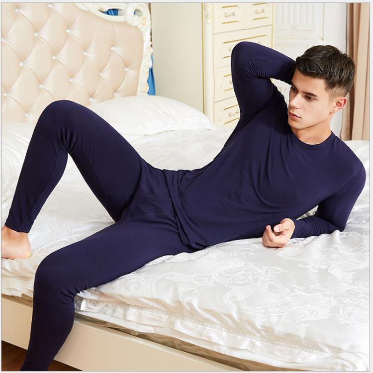 Couple wearing matching thermal sets at home