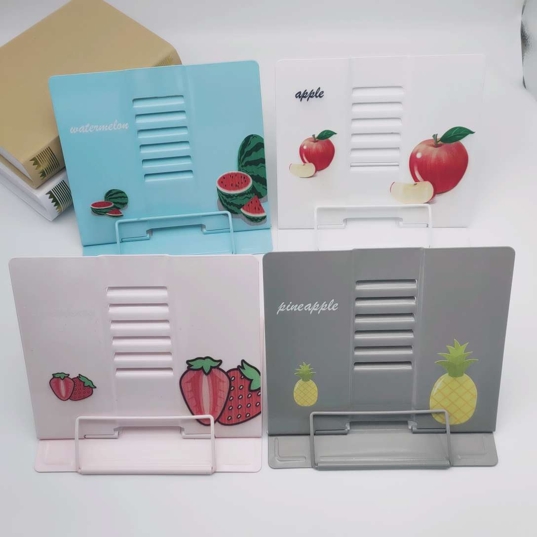 The cartoon fruit reading bookshelf stands upright The cartoon fruit reading bookshelf stands upright