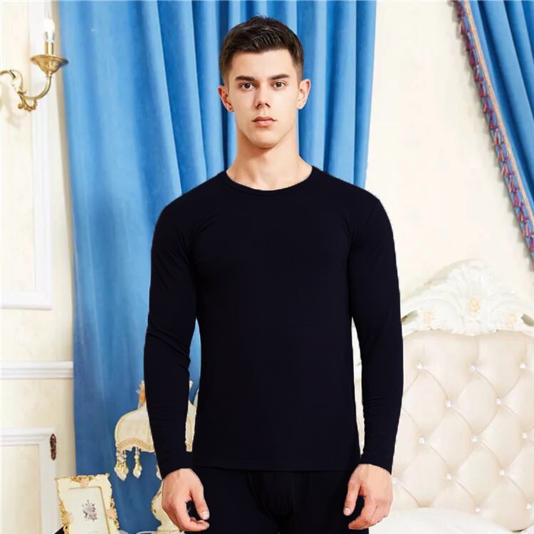 Man stretching in thermal underwear showing flexibility