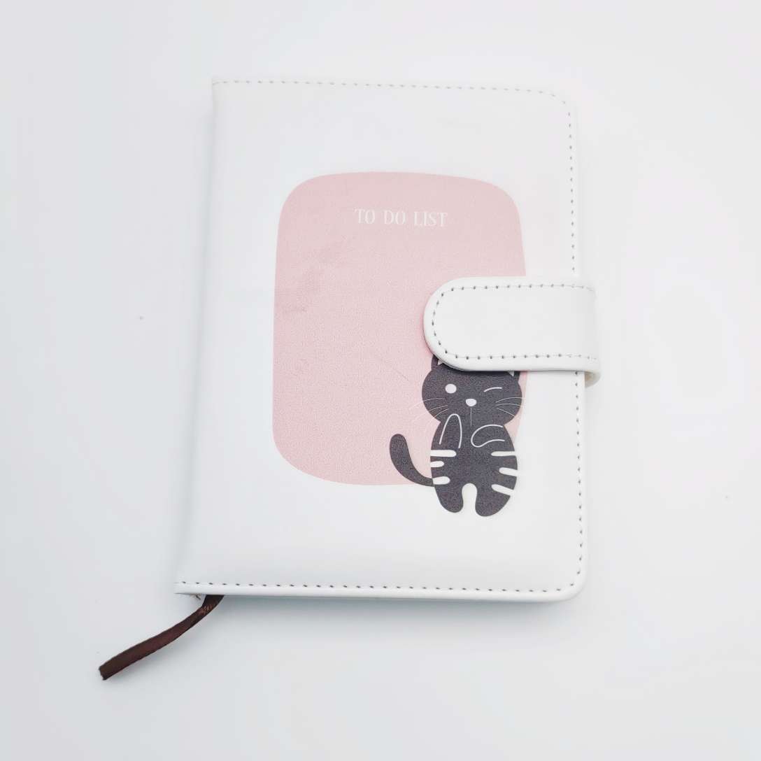 A student office bookend with a little cat's notebook details Picture