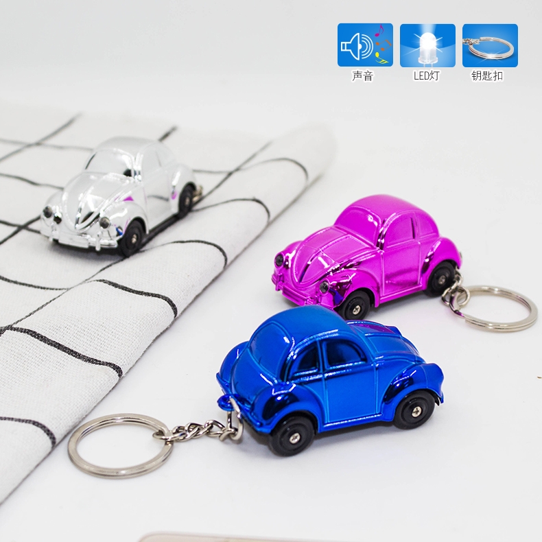 Led发声发光七彩电镀老爷车钥匙扣白底实物图