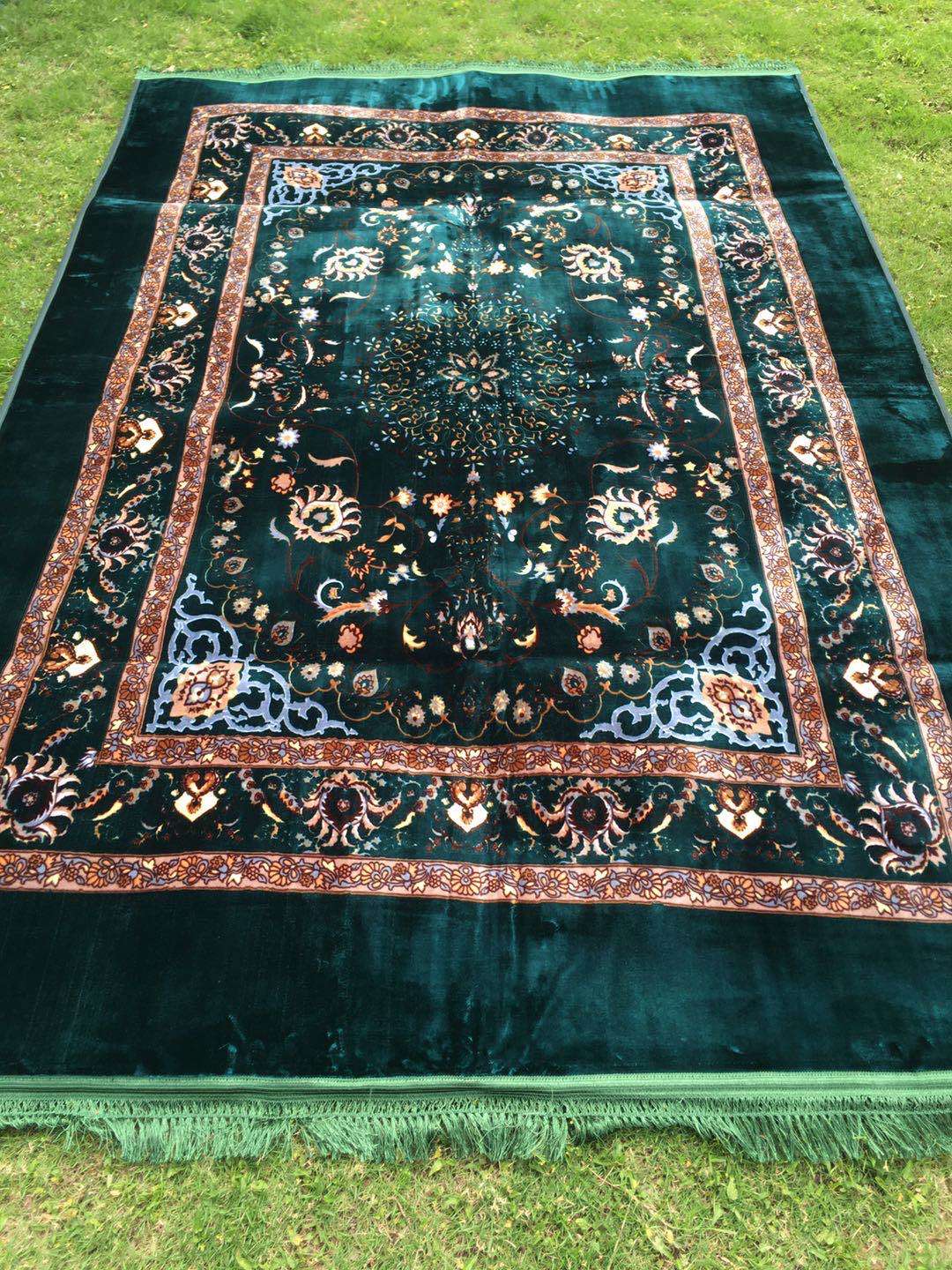 The bedding is a Muslim-printed carpet and a prayer carpet undefined