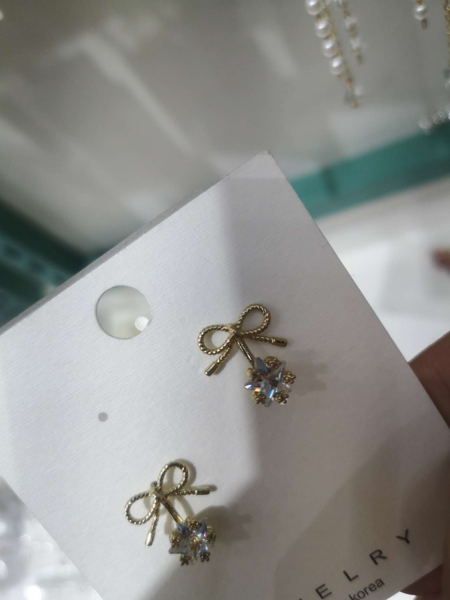 Bow-tied diamond earrings thumbnail