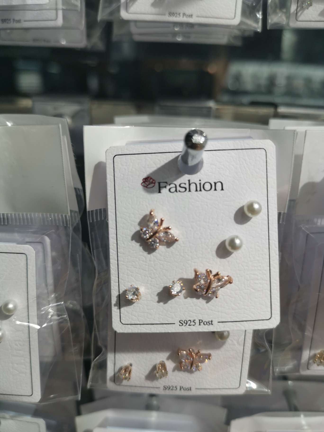 Three pairs of small butterfly ear studs