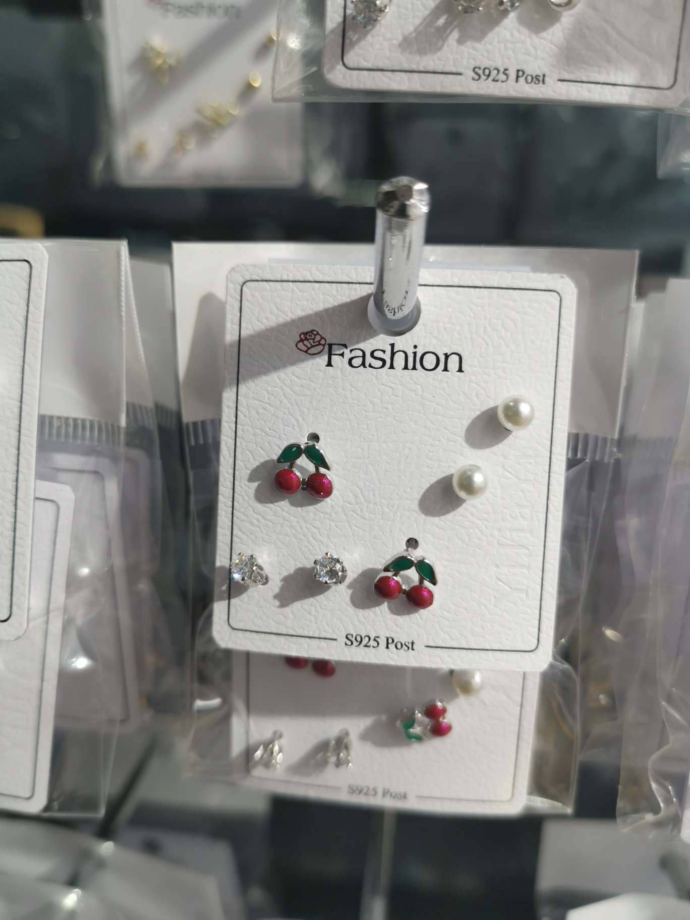 Three pairs of cherry stud earrings
